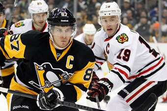 PITTSBURGH, PA - JANUARY 21:  Sidney Crosby #87 of the Pittsburgh Penguins skates against Jonathan Toews #19 of the Chicago Blackhawks in the first period during the game at Consol Energy Center on January 21, 2015 in Pittsburgh, Pennsylvania.  (Photo by 