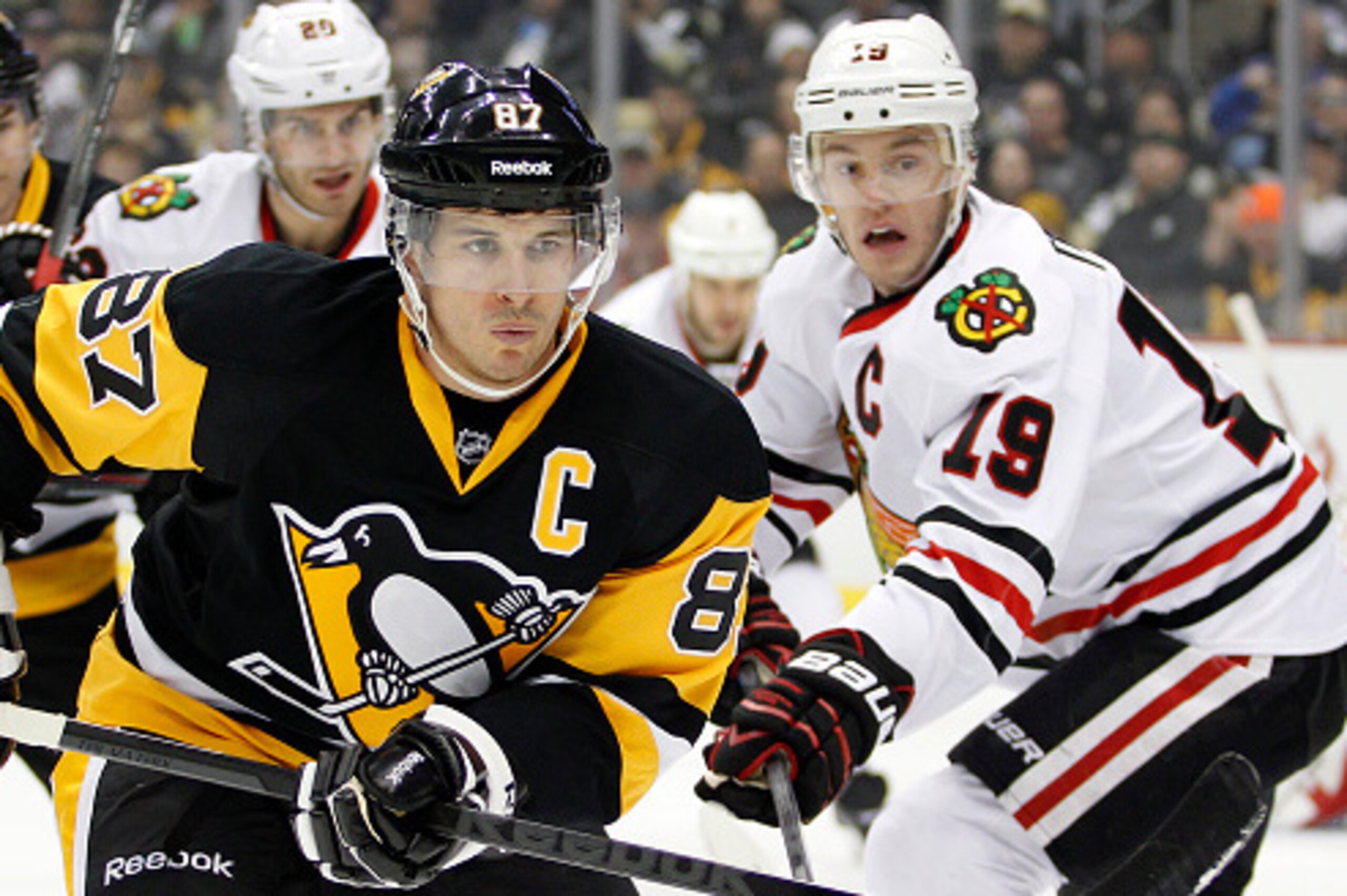 PITTSBURGH, PA - JANUARY 21:  Sidney Crosby #87 of the Pittsburgh Penguins skates against Jonathan Toews #19 of the Chicago Blackhawks in the first period during the game at Consol Energy Center on January 21, 2015 in Pittsburgh, Pennsylvania.  (Photo by 