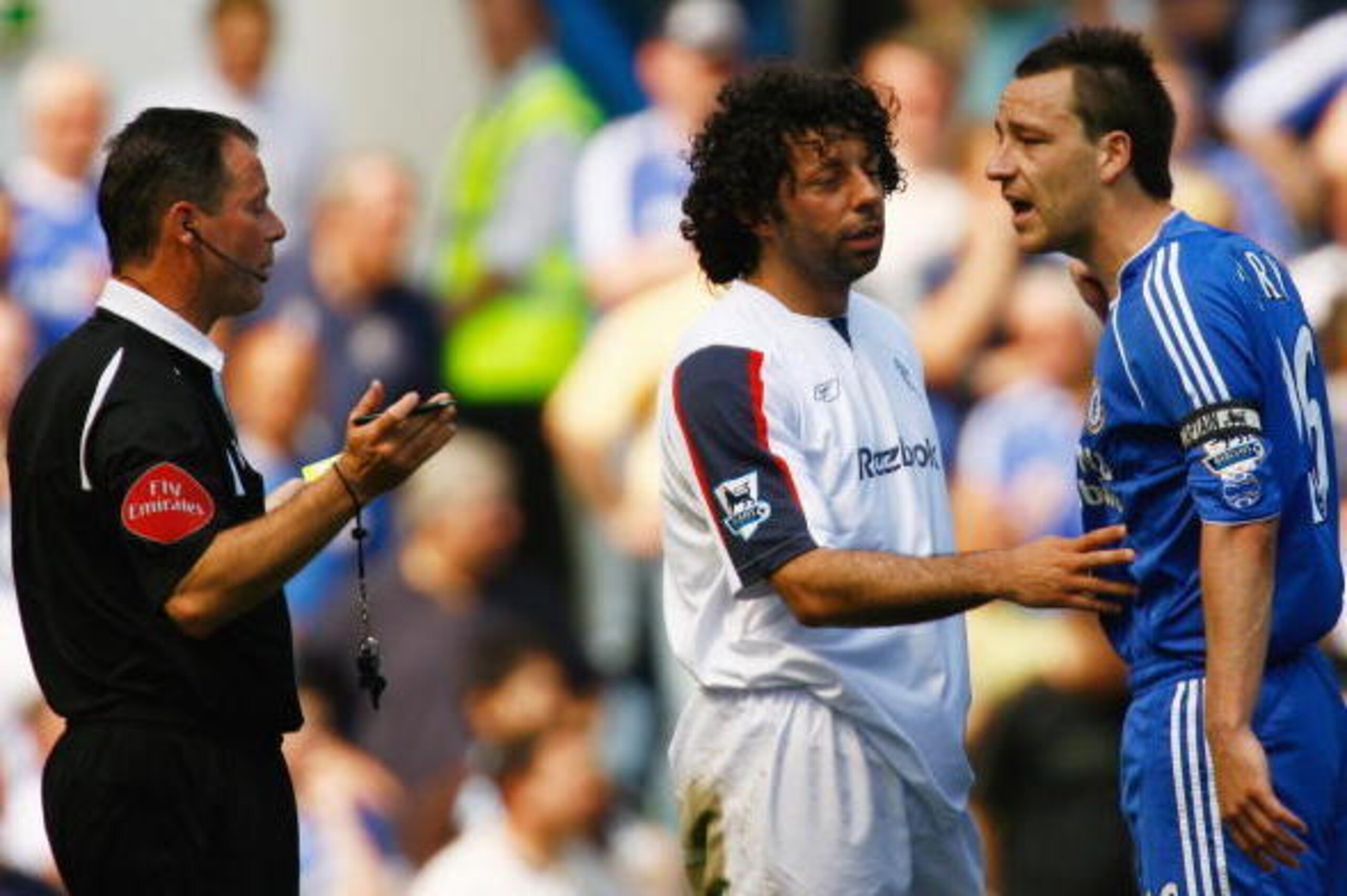 LONDON - APRIL 28:  John Terry of Chelsea (L) protests to referee Rob Styles as Ivan Campo of Bolton Wanderers intervenes during the Barclays Premiership match between Chelsea and Bolton Wanderers at Stamford Bridge on April 28, 2007 in London, England.  