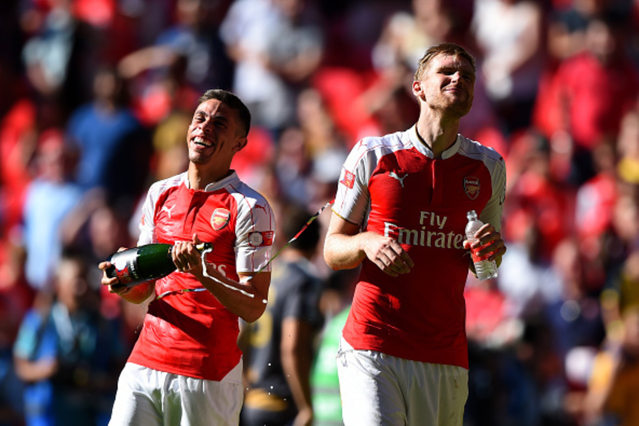 LONDON, ENGLAND - AUGUST 02: Gabriel (L) and Per Mertesacker (R) of Arsenal celebrate their team's 1-0 win in the FA Community Shield match between Chelsea and Arsenal at Wembley Stadium on August 2, 2015 in London, England.  (Photo by Shaun Botterill/Get