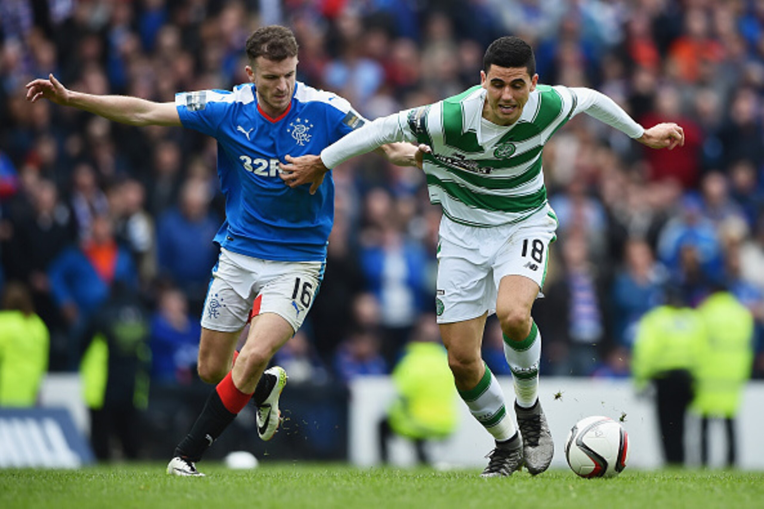 GLASGOW, SCOTLAND - APRIL 17: Andy Halliday of  Rangers holds Tomas Rogic of Celtic during the William Hill Scottish Cup semi final between Rangers and Celtic at Hampden Park on April 17, 2016 in Glasgow, Scotland.  (Photo by Jeff J Mitchell/Getty Images)