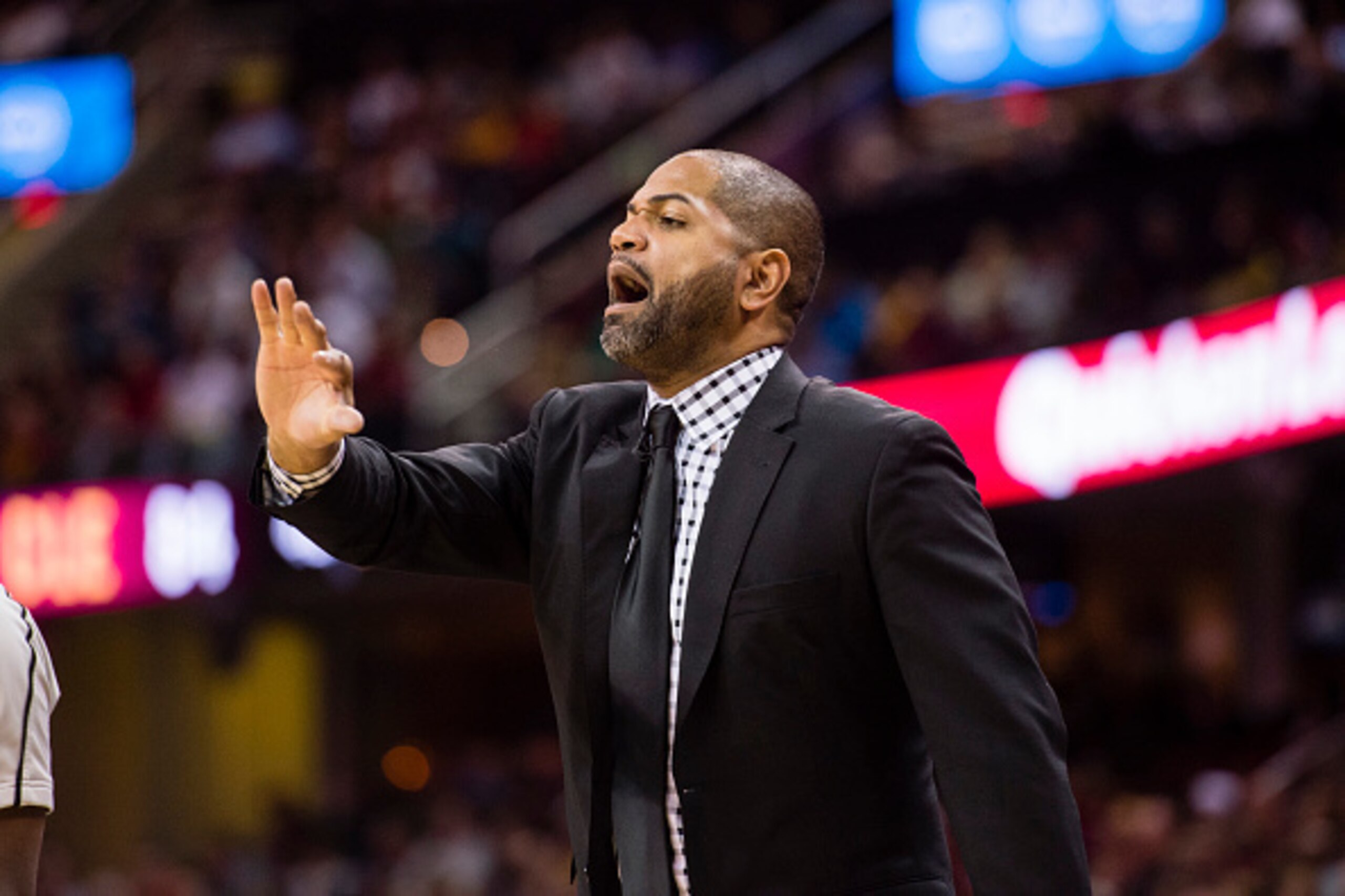 CLEVELAND, OH - MARCH 29: Head coach J.B. Bickerstaff of the Houston Rockets yells to his team during the second half against the Cleveland Cavaliers at Quicken Loans Arena on March 29, 2016 in Cleveland, Ohio. The Rockets defeated the Cavaliers 106-100. 