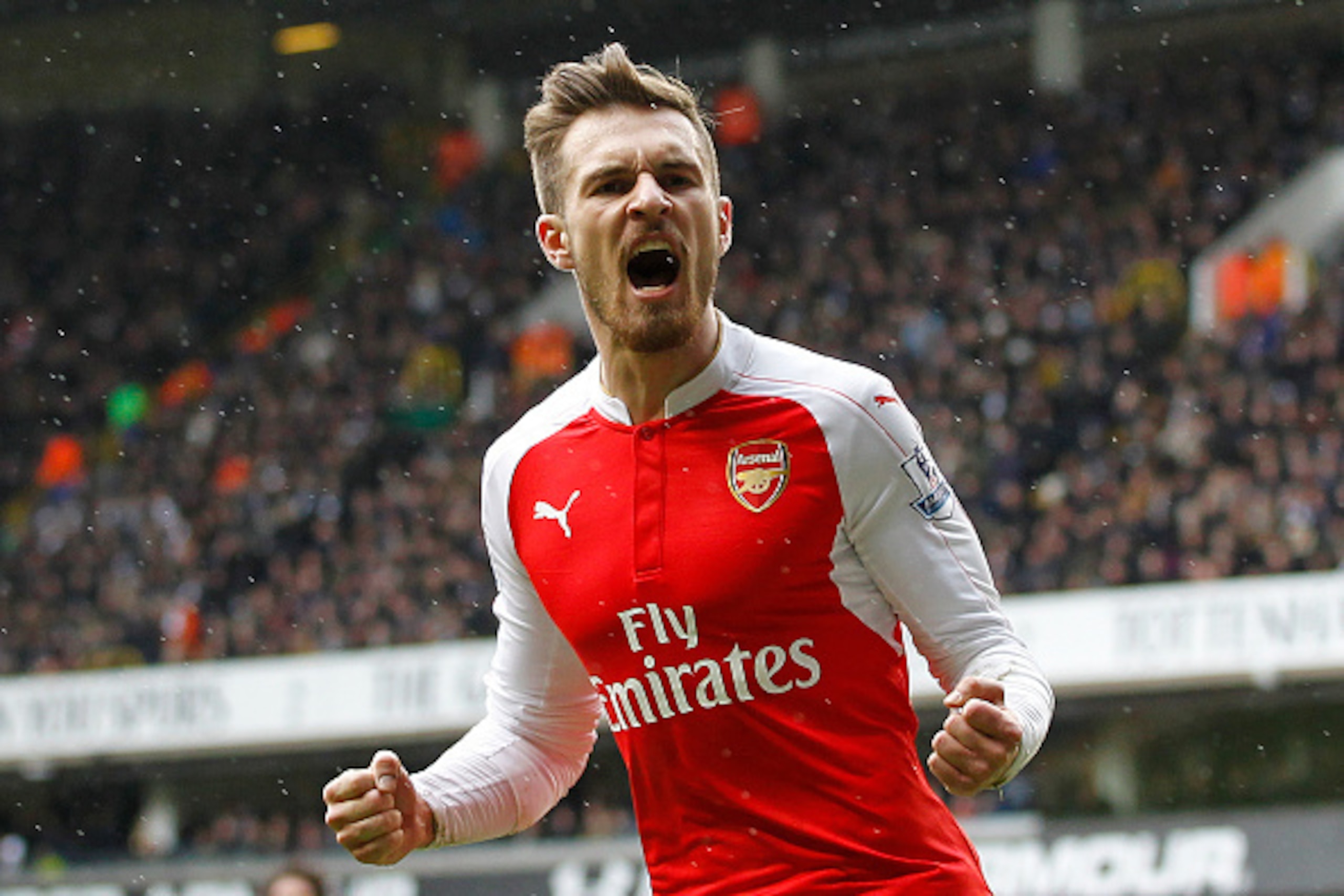 Arsenal's Welsh midfielder Aaron Ramsey celebrates scoring his team's first goal during the English Premier League football match between Tottenham Hotspur and Arsenal at White Hart Lane in London, on March 5, 2016. / AFP / IKIMAGES / IKimages / RESTRICTE