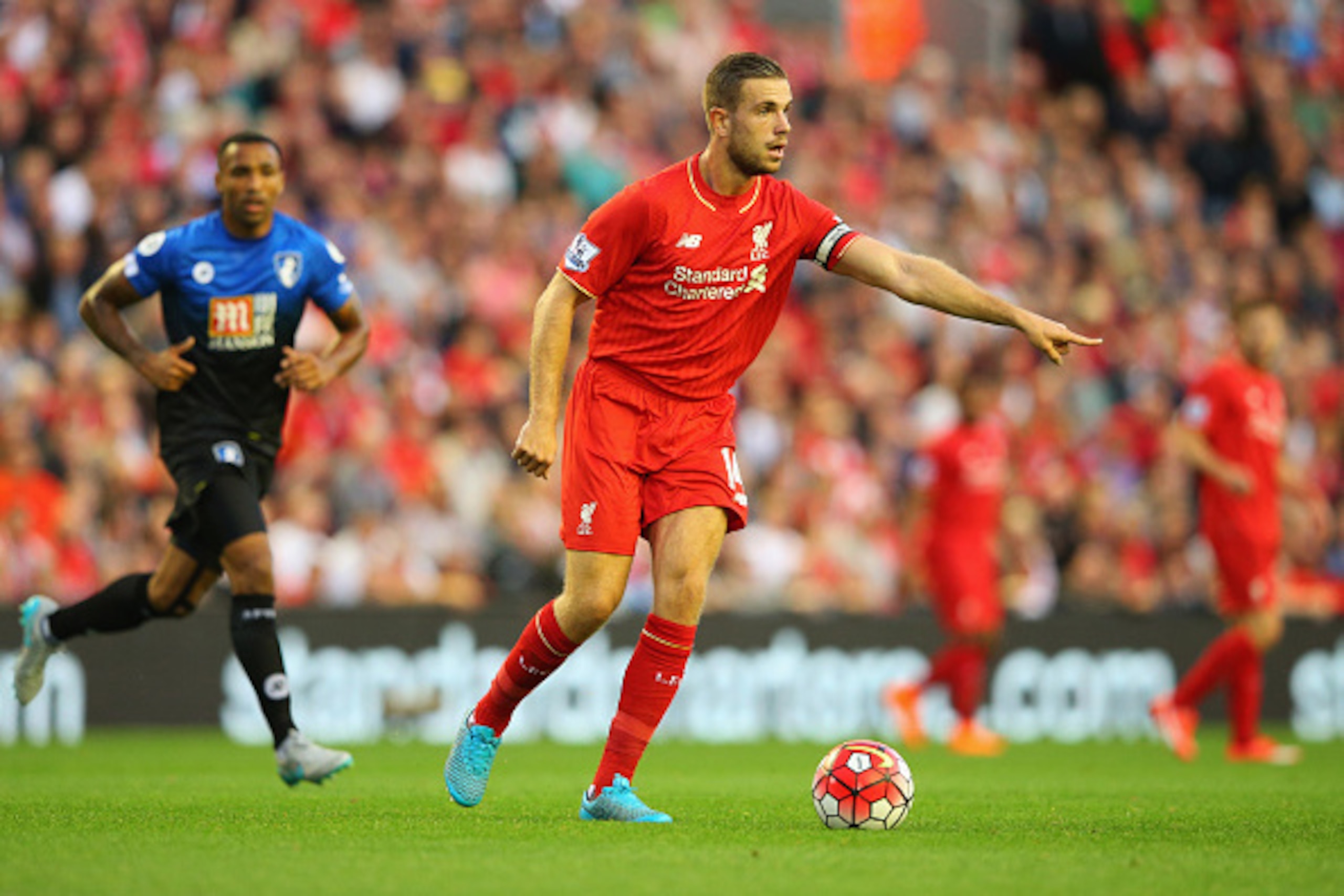 LIVERPOOL, ENGLAND - AUGUST 17:  Jordan Henderson of Liverpool signals as he runs with the ball during the Barclays Premier League match between Liverpool and A.F.C. Bournemouth at Anfield on August 17, 2015 in Liverpool, United Kingdom.  (Photo by Alex L