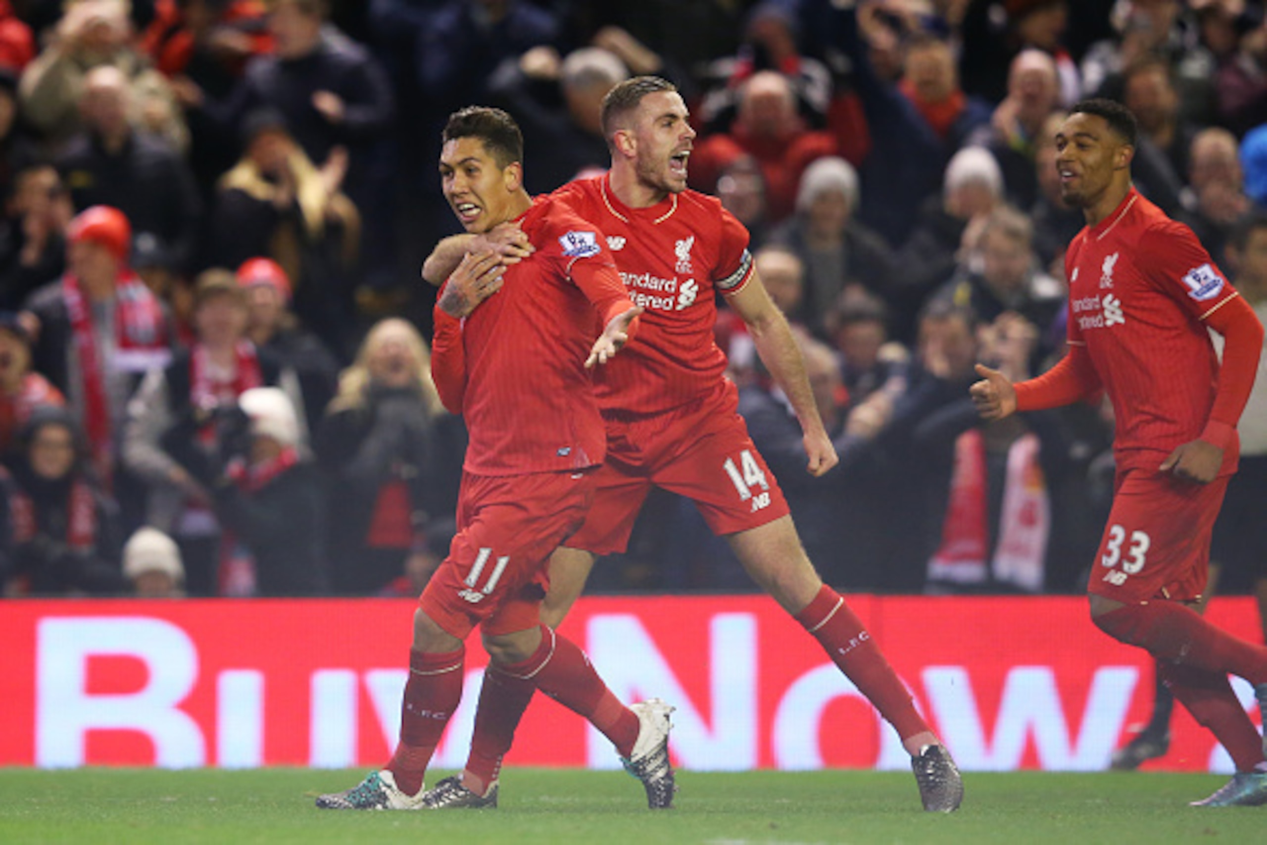 LIVERPOOL, ENGLAND - JANUARY 13:  Roberto Firmino (L) of Liverpool celebrates scoring his team's second goal with his team mate Jordan Henderson (R)  during the Barclays Premier League match between Liverpool and Arsenal at Anfield on January 13, 2016 in 