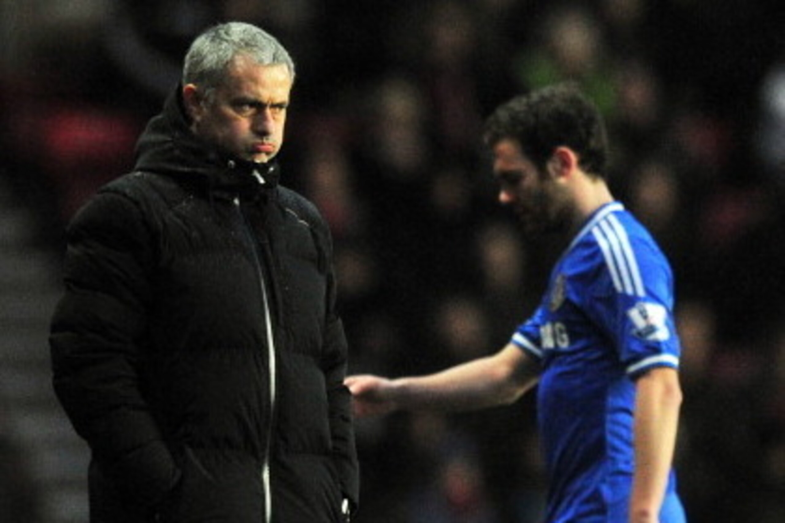 Chelsea's Portuguese manager Jose Mourinho (L) watches after Chelsea's Spanish midfielder Juan Mata (R) is substituted during the English Premier League football match between Southampton and Chelsea at St Mary's Stadium in Southampton, southern England, 