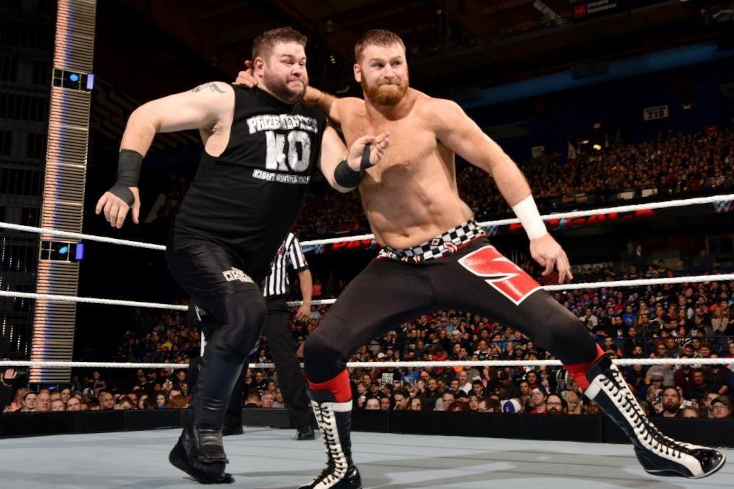 Sami Zayn battles Kevin Owens.