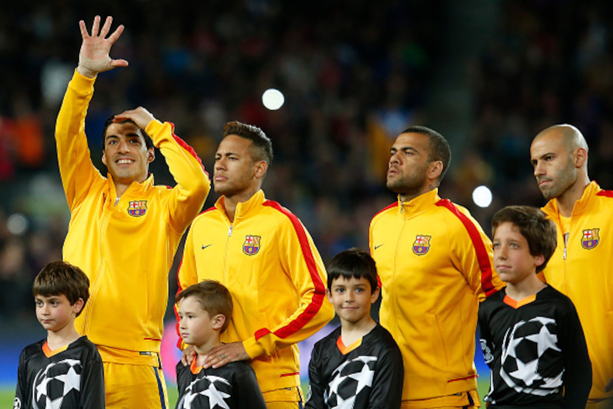 (L to R)  Barcelona's Uruguayan forward Luis Suarez, Barcelona's Brazilian forward Neymar, Barcelona's Brazilian defender Dani Alves and Barcelona's Argentinian midfielder Javier Mascherano line up before the UEFA Champions League quarter finals first leg