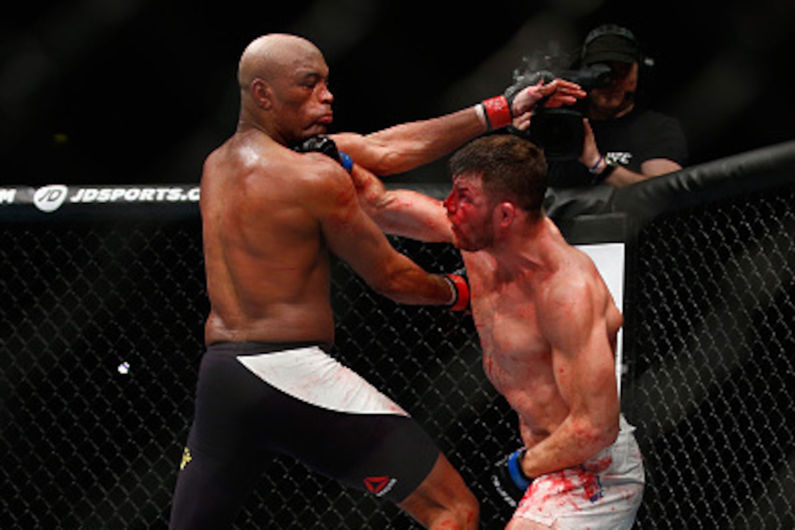 LONDON, ENGLAND - FEBRUARY 27:  Michael Bisping of Great Britain (R) in action as he beats Anderson Silva of Brazil during the Middleweight Bout of the UFC Fight Night  at The O2 Arena on February 27, 2016 in London, England.  (Photo by Christopher Lee/Ge
