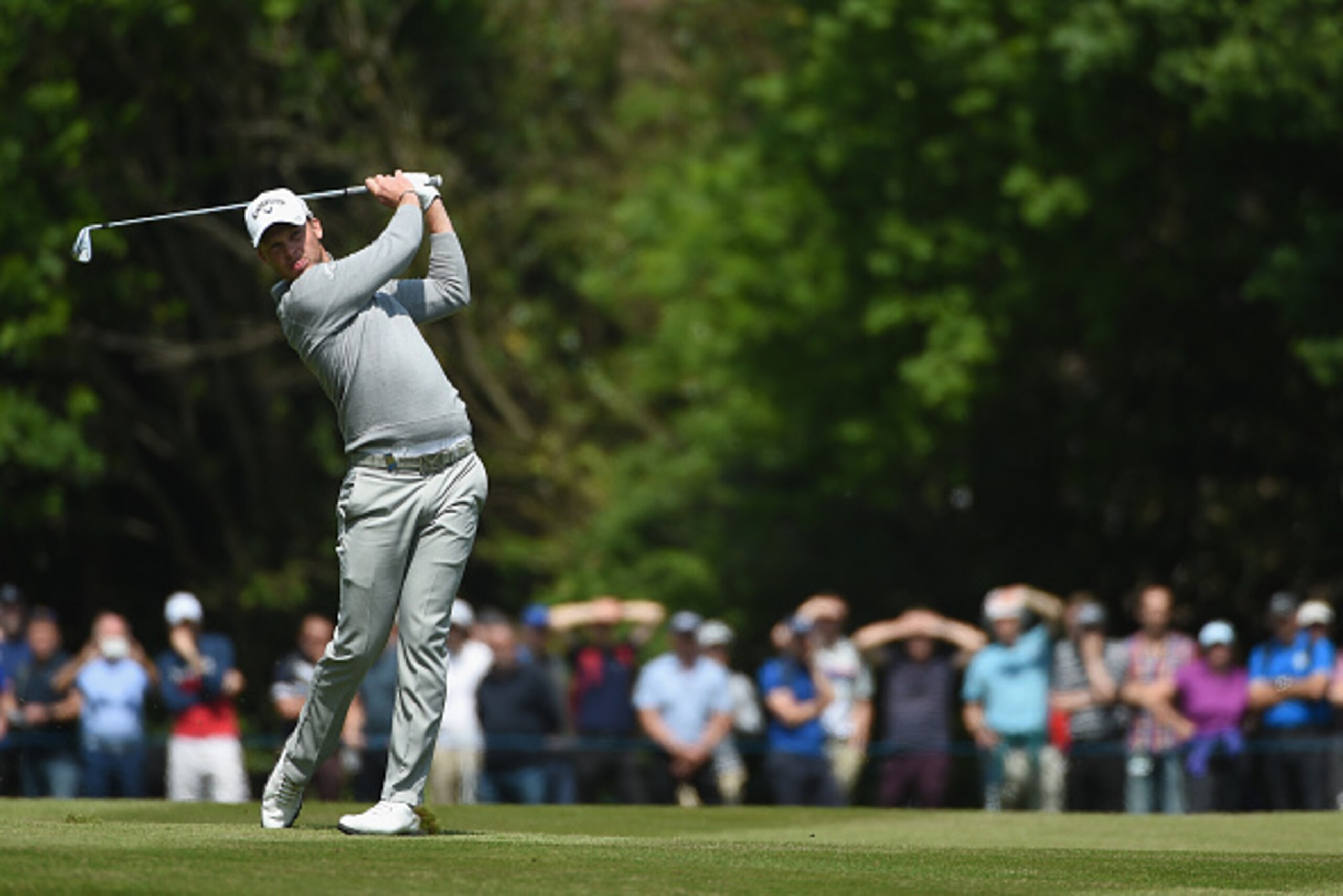 VIRGINIA WATER, ENGLAND - MAY 27: Danny Willett of England hits his 2nd shot on the 18th hole during day two of the BMW PGA Championship at Wentworth on May 27, 2016 in Virginia Water, England. (Photo by Ross Kinnaird/Getty Images) VIRGINIA WATER, ENGLAND - MAY 27: Danny Willett of England hits his 2nd shot on the 18th hole during day two of the BMW PGA Championship at Wentworth on May 27, 2016 in Virginia Water, England. (Photo by Ross Kinnaird/Getty Images)