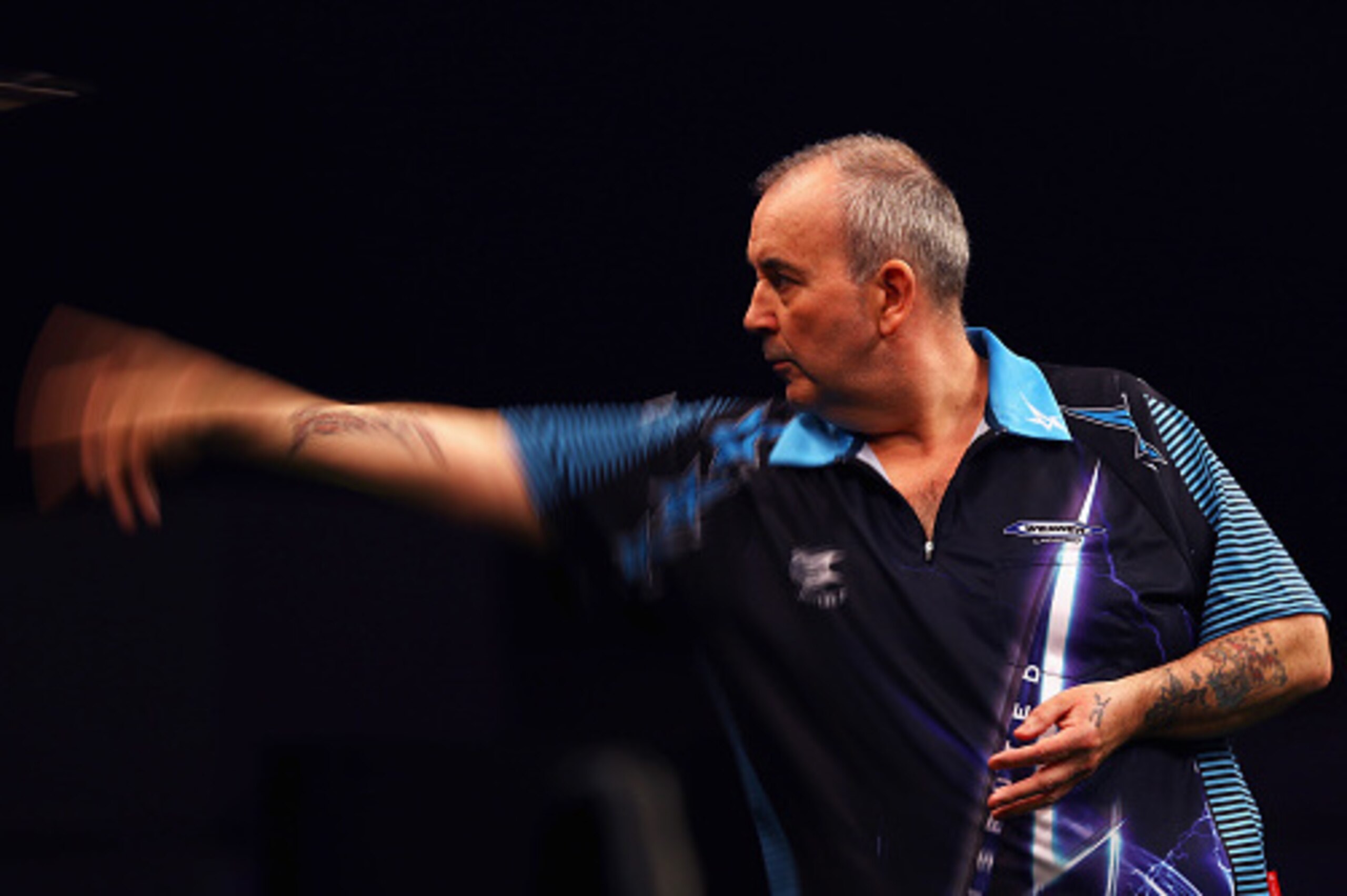 ROTTERDAM, NETHERLANDS - MAY 12: Phil 'The Power' Taylor of England plays a shot in his match against Michael van Gerwen of the Netherlands during the Darts Betway Premier League Night 15 at Rotterdam Ahoy on May 12, 2016 in Rotterdam, . (Photo by Dean ROTTERDAM, NETHERLANDS - MAY 12: Phil 'The Power' Taylor of England plays a shot in his match against Michael van Gerwen of the Netherlands during the Darts Betway Premier League Night 15 at Rotterdam Ahoy on May 12, 2016 in Rotterdam, . (Photo by Dean