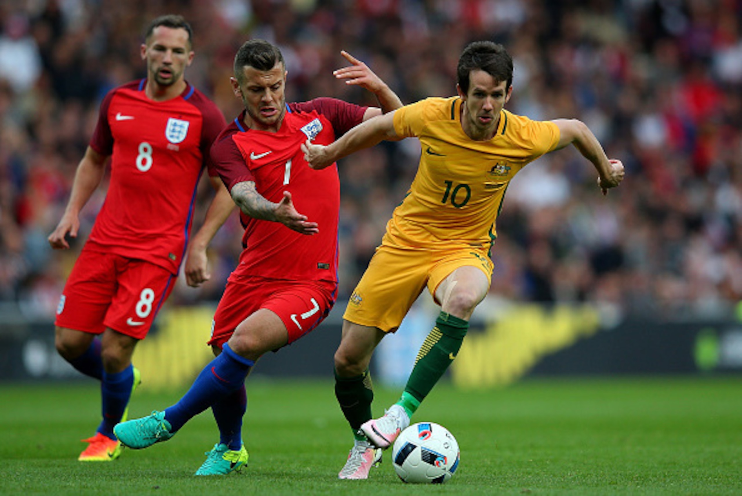 SUNDERLAND, ENGLAND - MAY 27:  Robbie Kruse of Australia holds off the challenge of Jack Wilshere of England during the International Friendly match between England and Australia at Stadium of Light on May 27, 2016 in Sunderland, England.  (Photo by Alex 