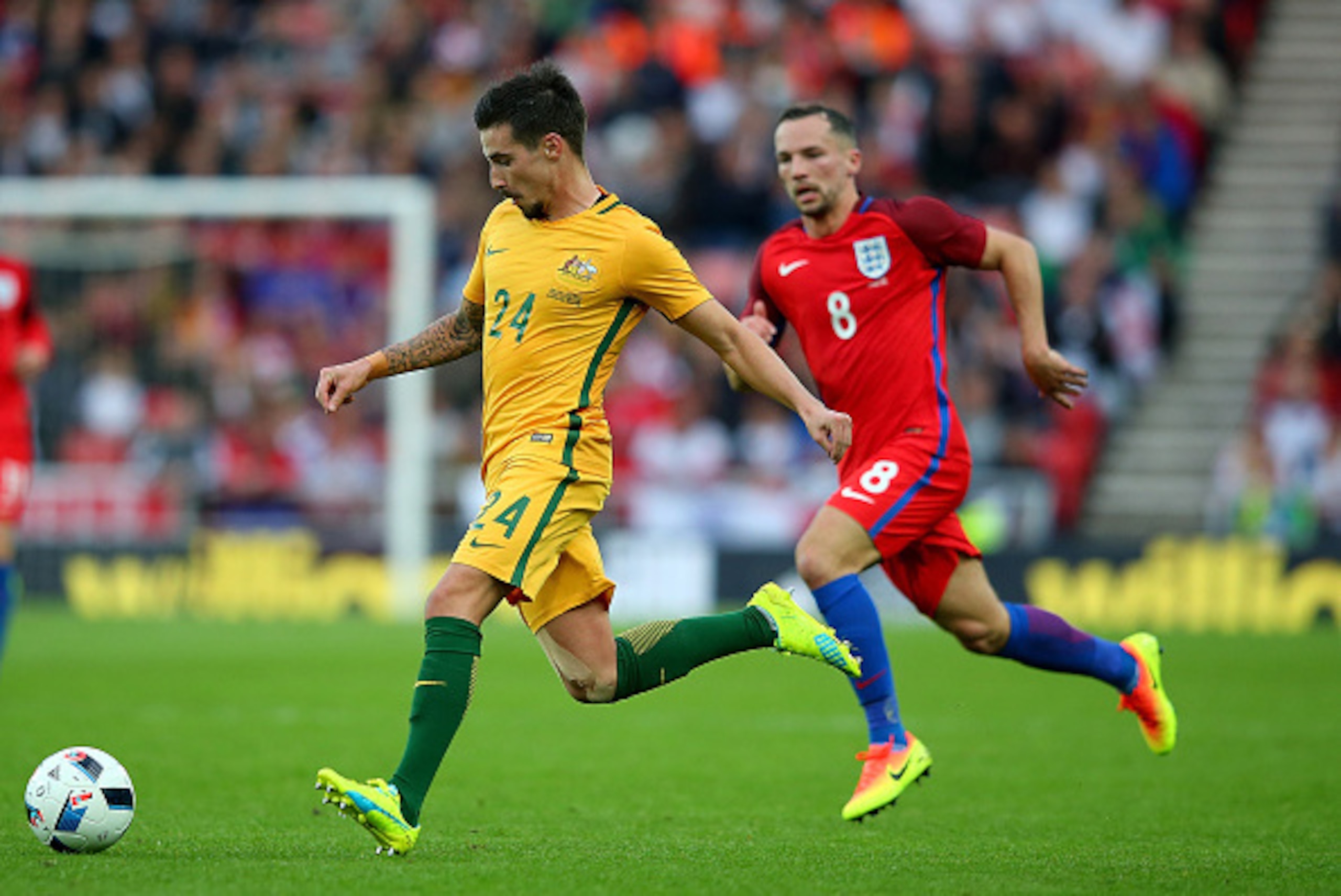 SUNDERLAND, ENGLAND - MAY 27:  Jamie Maclaren of Australia advances under pressure from Danny Drinkwater of England during the International Friendly match between England and Australia at Stadium of Light on May 27, 2016 in Sunderland, England.  (Photo b