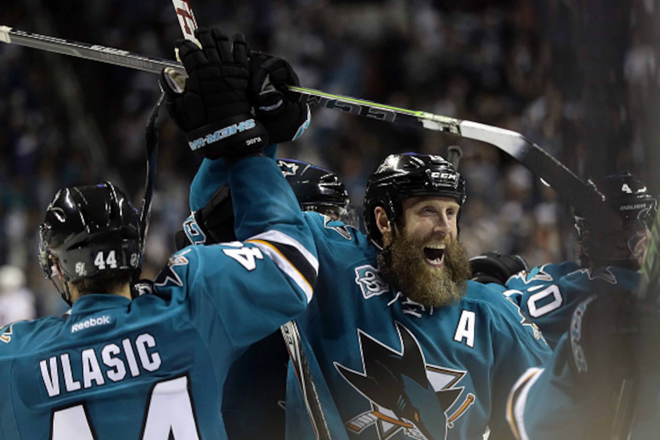 SAN JOSE, CA - MAY 25:  Joe Thornton #19 of the San Jose Sharks celebrates with Marc-Edouard Vlasic #44 of the San Jose Sharks after they beat the St. Louis Blues in Game Six of the Western Conference Final during the 2016 NHL Stanley Cup Playoffs at SAP 