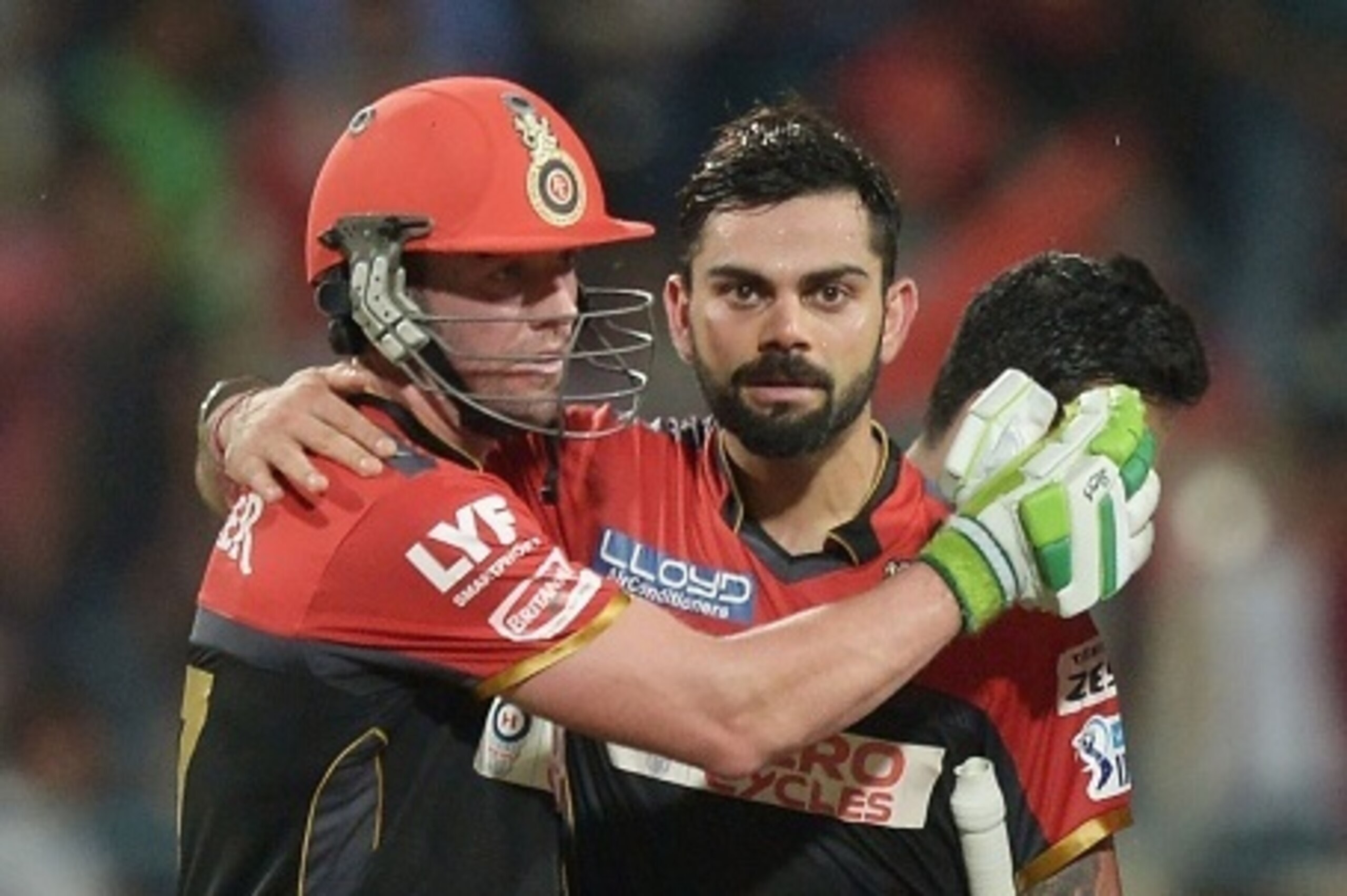 Royal Challengers Bangalore captain Virat Kohli (R) and AB de Villiers celebrate after winning the match after the 2016 Indian Premier League (IPL) Twenty20 cricket match between Kolkata Knight Riders and Royal Challengers Bangalore at the Eden Gardens Cr