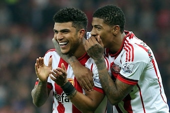 Sunderland's US defender DeAndre Yedlin (L) and Sunderland's Dutch defender Patrick van Aanholt celebrate after a 3-0 victory at the end of the English Premier League football match between Sunderland and Everton at the Stadium of Light in Sunderland, nor