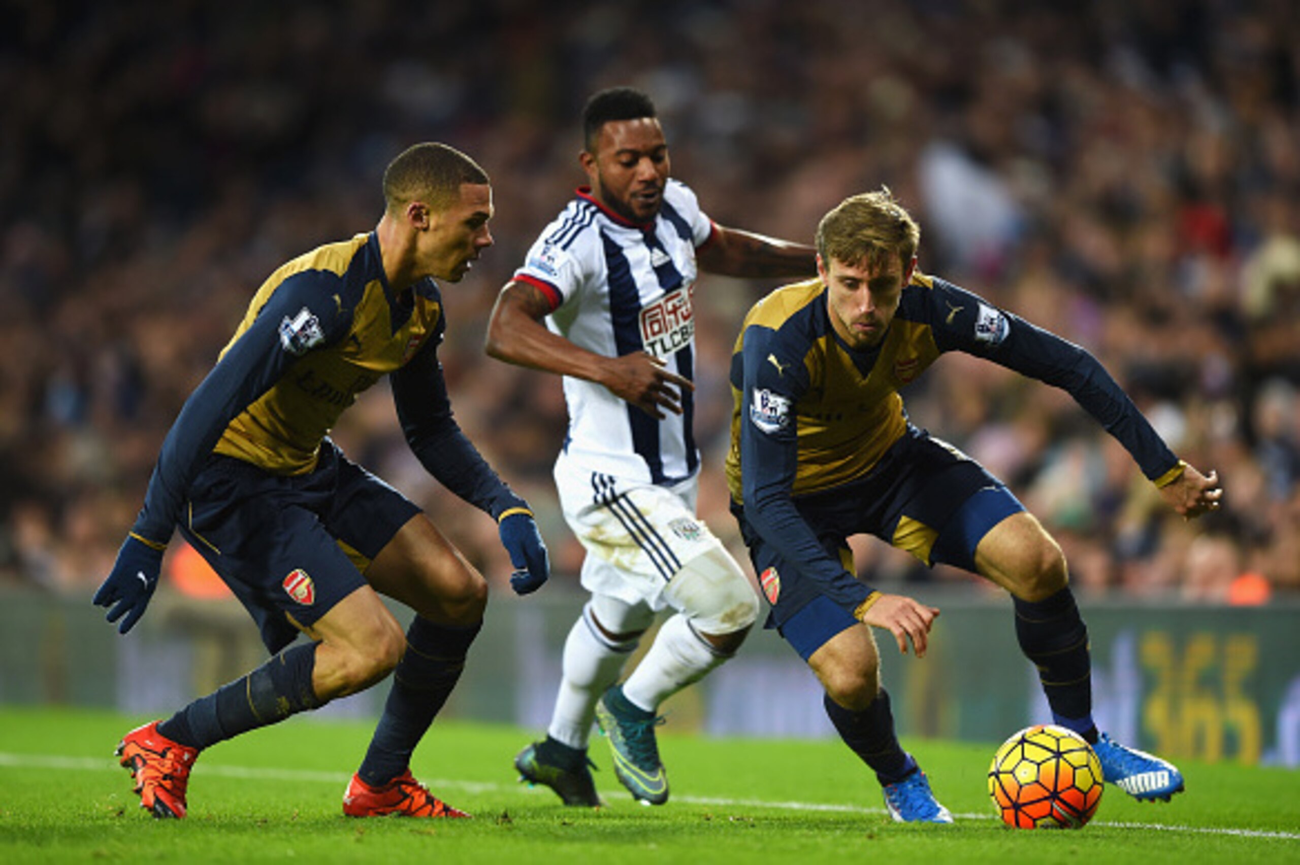 WEST BROMWICH, ENGLAND - NOVEMBER 21: Stephane Sessegnon (C) of West Bromwich Albion competes against Nacho Monreal (R) and Kieran Gibbs (L) of Arsenal during the Barclays Premier League match between West Bromwich Albion and Arsenal at The Hawthorns on WEST BROMWICH, ENGLAND - NOVEMBER 21: Stephane Sessegnon (C) of West Bromwich Albion competes against Nacho Monreal (R) and Kieran Gibbs (L) of Arsenal during the Barclays Premier League match between West Bromwich Albion and Arsenal at The Hawthorns on