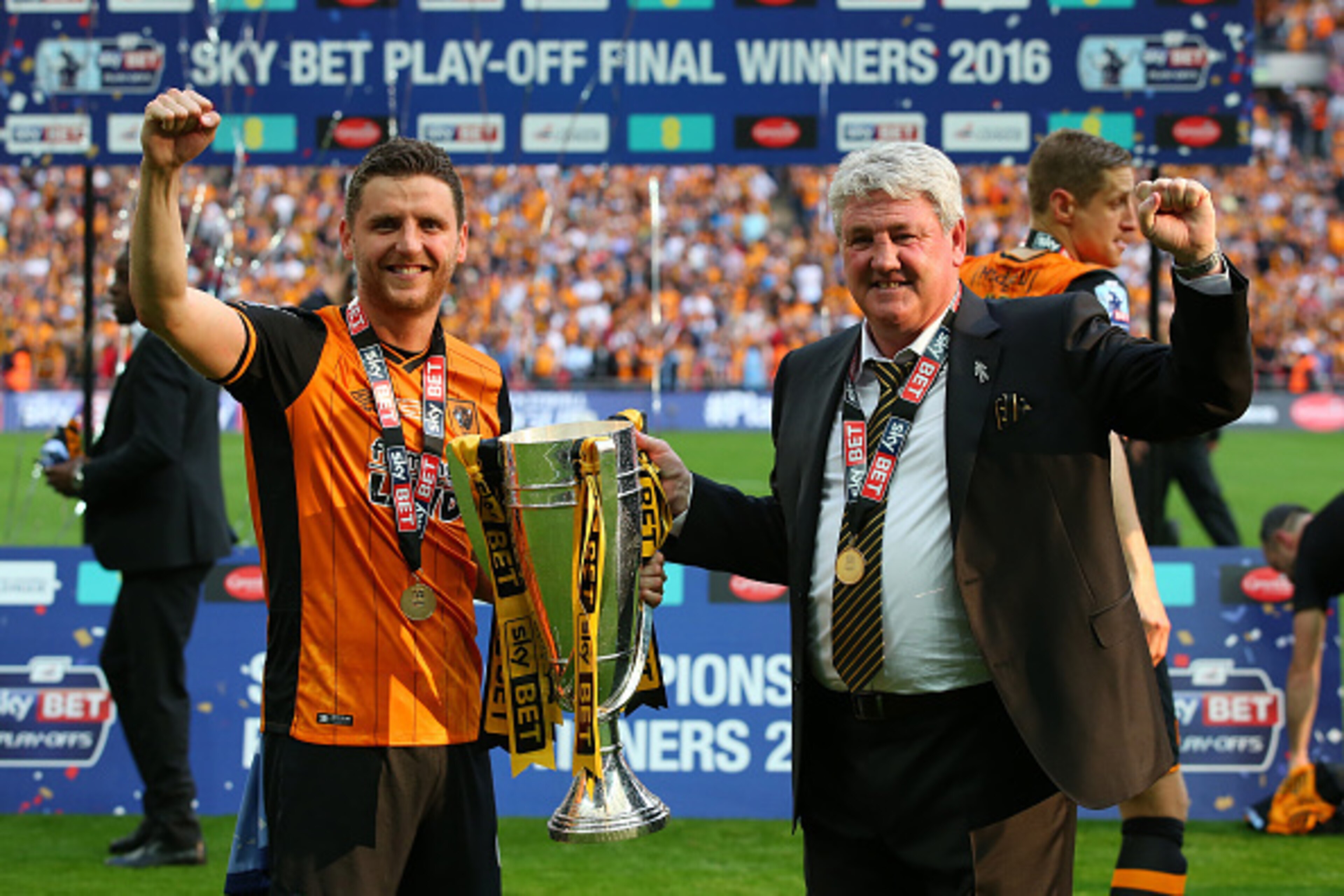 LONDON, ENGLAND - MAY 28: Father and son Alex Bruce and Steve Bruce, manager of Hull City celebrate with the trophy after the Sky Bet Championship Play Off Final match between Hull City and Sheffield Wednesday at Wembley Stadium on May 28, 2016 in London LONDON, ENGLAND - MAY 28: Father and son Alex Bruce and Steve Bruce, manager of Hull City celebrate with the trophy after the Sky Bet Championship Play Off Final match between Hull City and Sheffield Wednesday at Wembley Stadium on May 28, 2016 in London