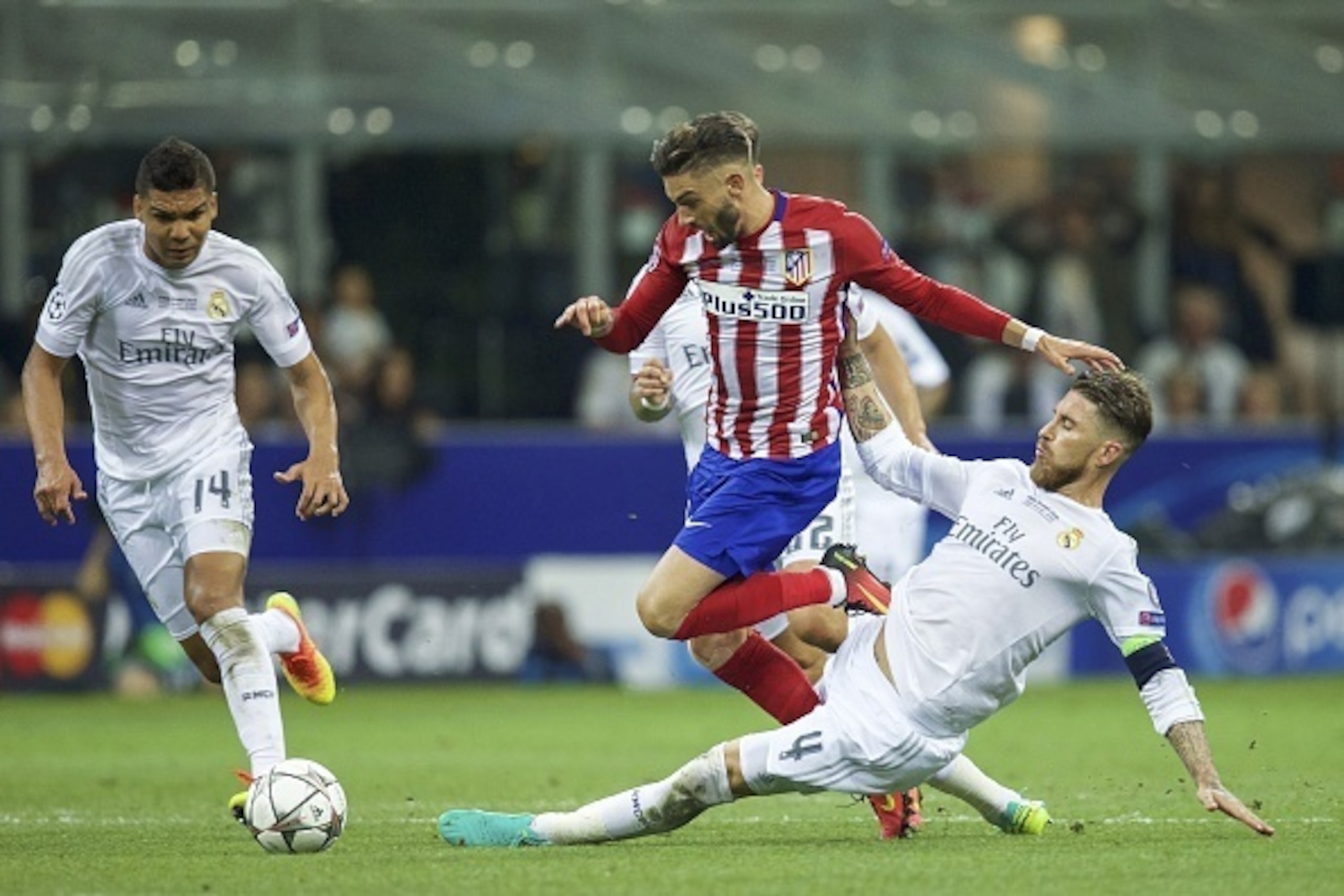 (L-R) Casemiro of Real Madrid, Yannick Carrasco of Club Atletico de Madrid, Sergio Ramos of Real Madrid during the UEFA Champions League final match between Real Madrid and Atletico Madrid on May 28, 2016 at the Giuseppe Meazza San Siro stadium in Milan, 