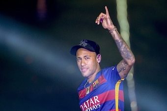 TOPSHOT - Barcelona's Brazilian forward Neymar acknowledges the crowd during celebrations at the Camp Nou stadium in Barcelona on May 23, 2016 following their Spanish 'Copa del Rey' (King's Cup) final football match 2-0 victory over Sevilla FC yesterday a
