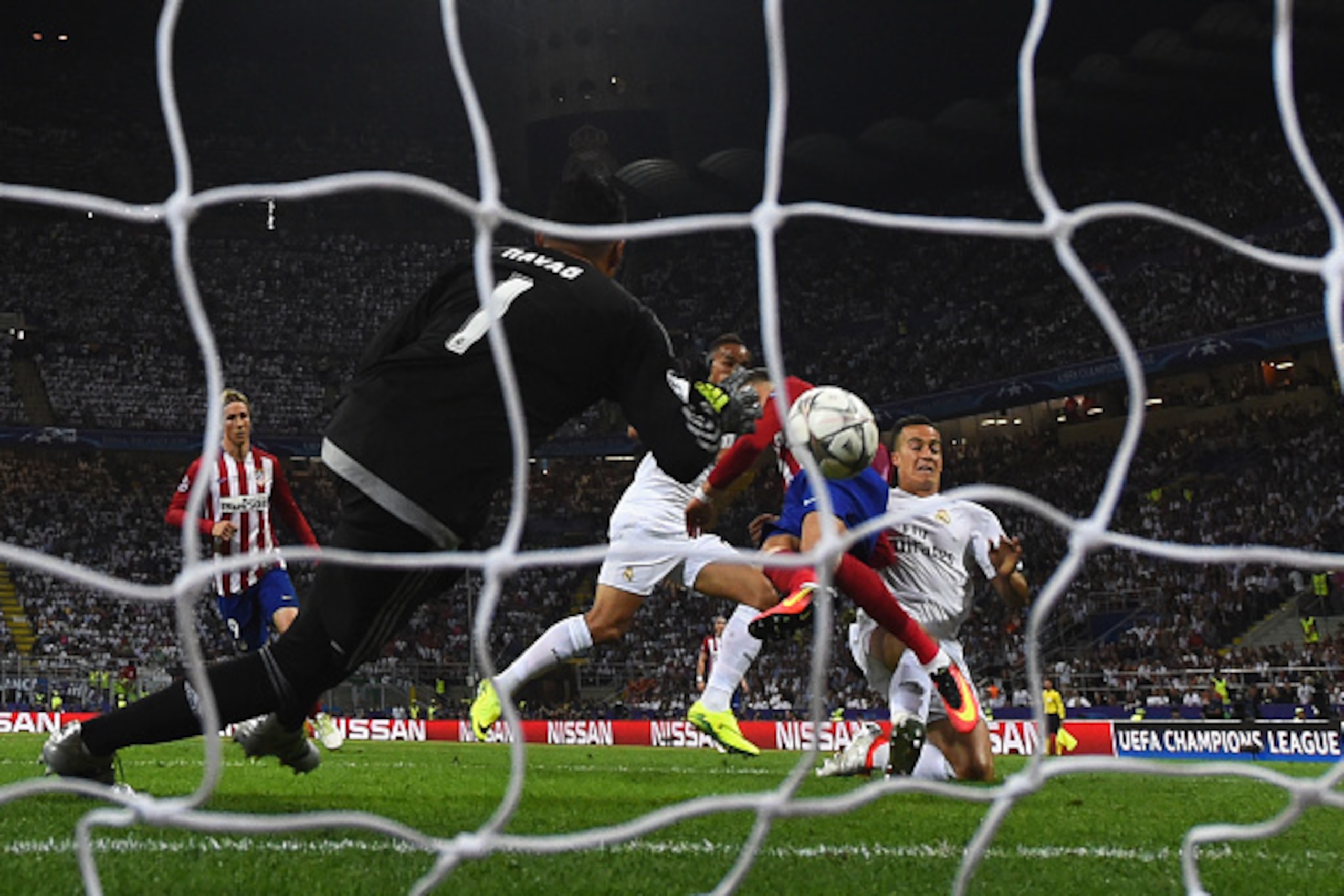MILAN, ITALY - MAY 28:  Yannick Carrasco of Atletico Madrid beats Lucas Vazquez of Real Madrid to the ball to score the equalising goal during the UEFA Champions League Final match between Real Madrid and Club Atletico de Madrid at Stadio Giuseppe Meazza 