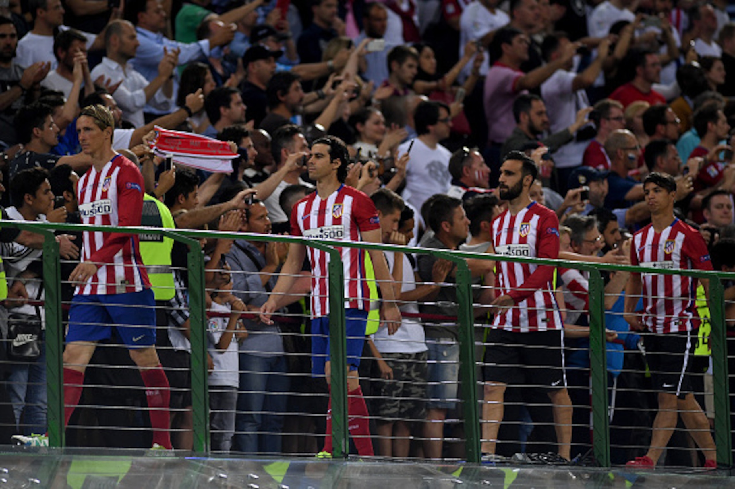 MILAN, ITALY - MAY 28:  A dejected Fernando Torres of Atletico Madrid leads his mates to receives the medals after the UEFA Champions League Final match between Real Madrid and Club Atletico de Madrid at Stadio Giuseppe Meazza on May 28, 2016 in Milan, It