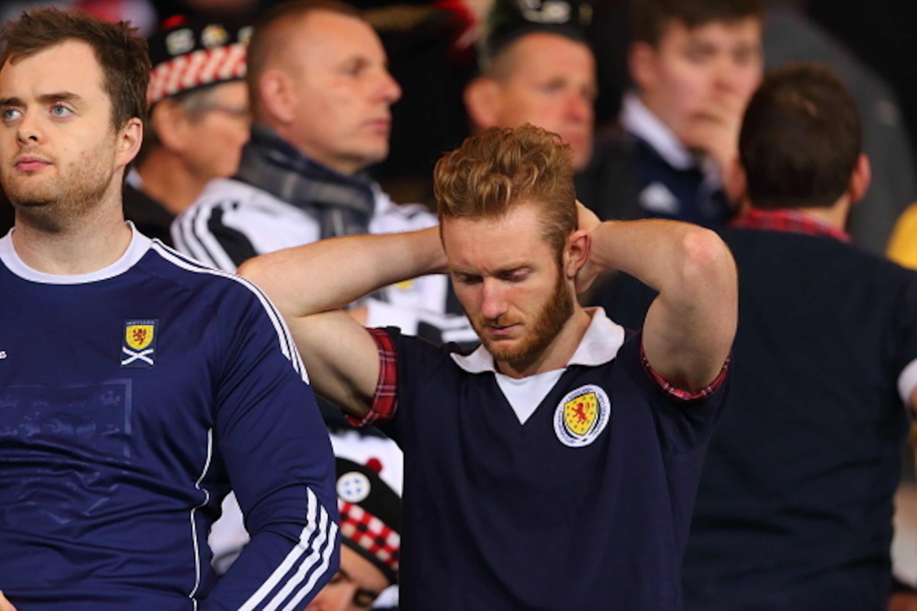 GLASGOW, SCOTLAND - OCTOBER 08:  A Scotland fan looks dejected after his team conceding a goal in the last minute during the  UEFA EURO 2016 qualifier between Scotland and Poland at Hampden Park on October 8, 2015 in Glasgow, Scotland.  (Photo by Matthew 