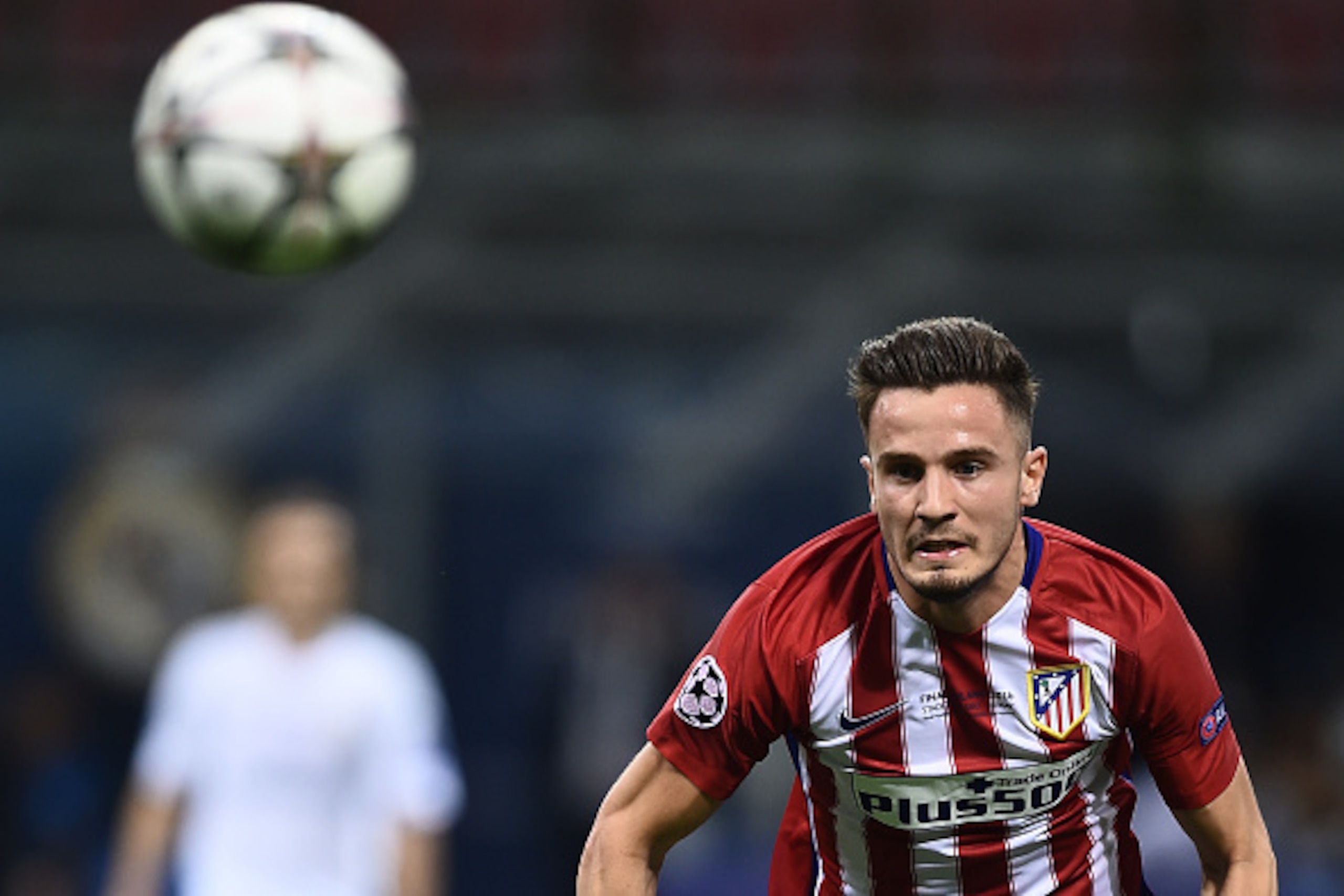 Atletico Madrid's Spanish midfielder Saul Niguez eyes the ball during the UEFA Champions League final football match between Real Madrid and Atletico Madrid at San Siro Stadium in Milan, on May 28, 2016. / AFP / FILIPPO MONTEFORTE        (Photo credit sho