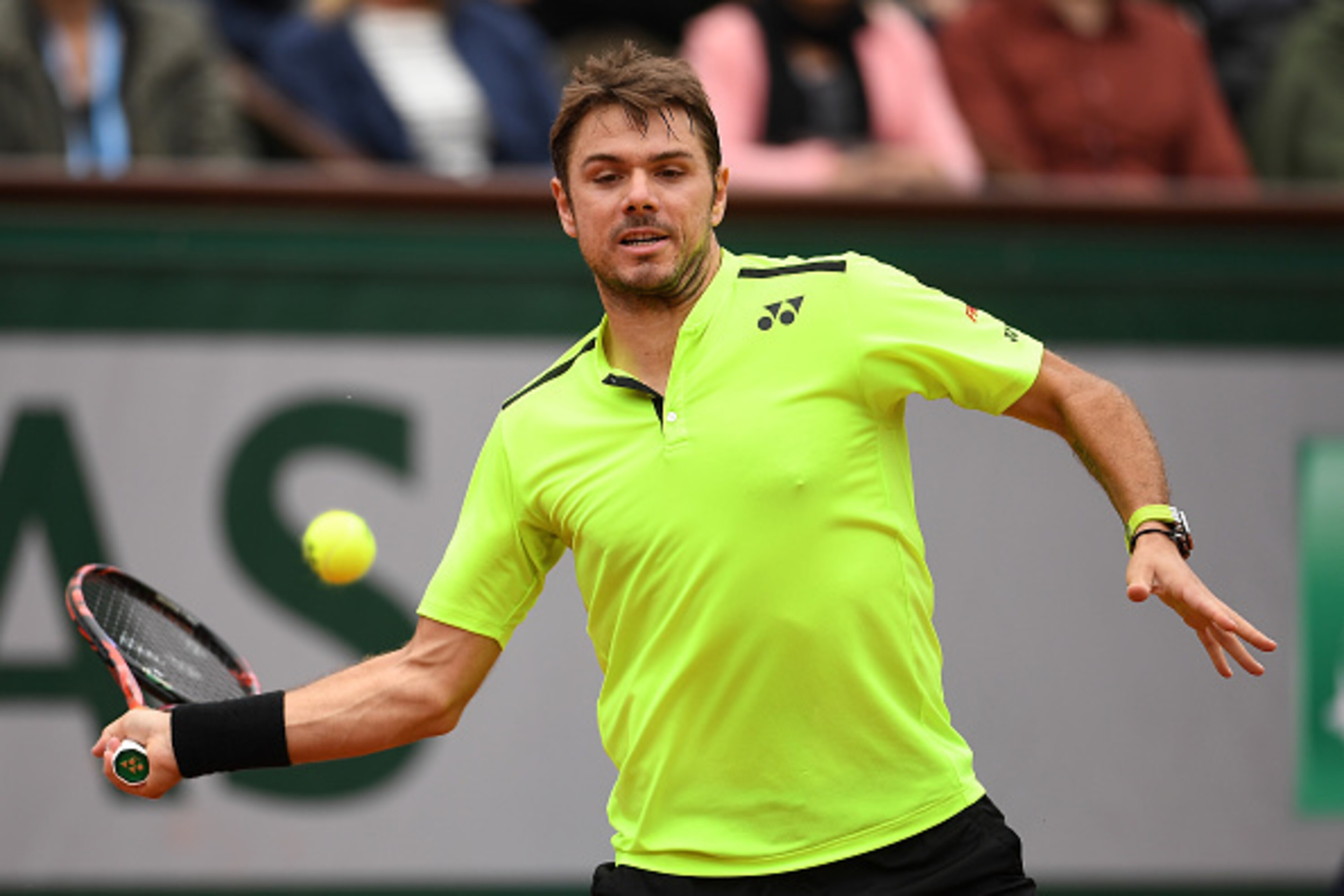 PARIS, FRANCE - MAY 29:  Stan Wawrinka of Switzerland hits a backhand during the Men's Singles fourth round match against Viktor Troicki of Serbia on day eight of the 2016 French Open at Roland Garros on May 29, 2016 in Paris, France.  (Photo by Dennis Gr