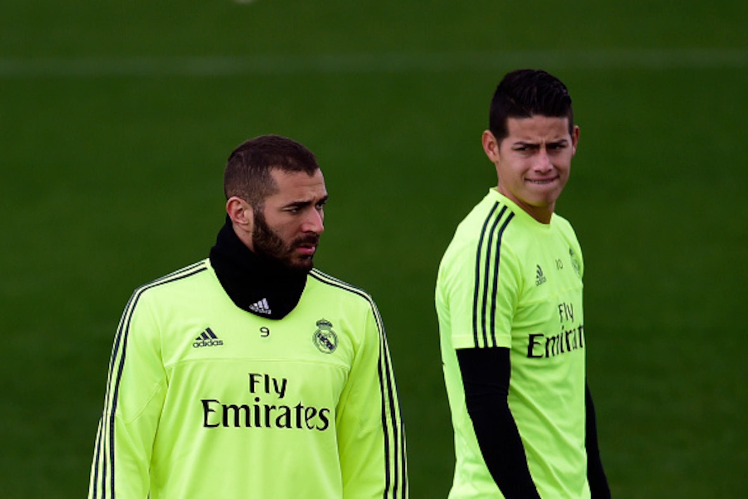Real Madrid's Colombian midfielder James Rodriguez (R) looks at Real Madrid's French forward Karim Benzema as they take part in a training session at Valdebebas Sport City in Madrid on March 19, 2016 on the eve of their Liga football match against Sevilla
