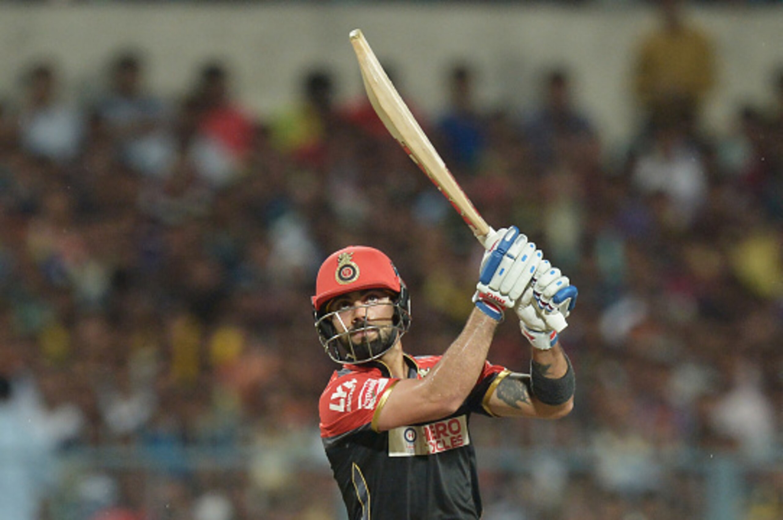 Royal Challengers Bangalore captain Virat Kohli plays a shot during the 2016 Indian Premier League (IPL) Twenty20 cricket match between Kolkata Knight Riders and Royal Challengers Bangalore at the Eden Gardens Cricket Stadium in Kolkata on May 16, 2016.  