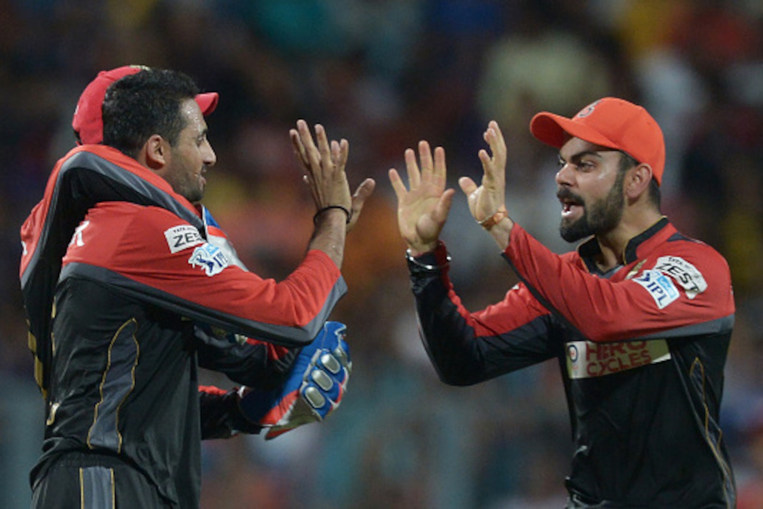 Royal Challengers Bangalore captain Virat Kohli (R) celebrates with teammates after the dismissal of Kolkata Knight Riders Suryakumar Yadav during the 2016 Indian Premier League (IPL) Twenty20 cricket match between Kolkata Knight Riders and Royal Challeng