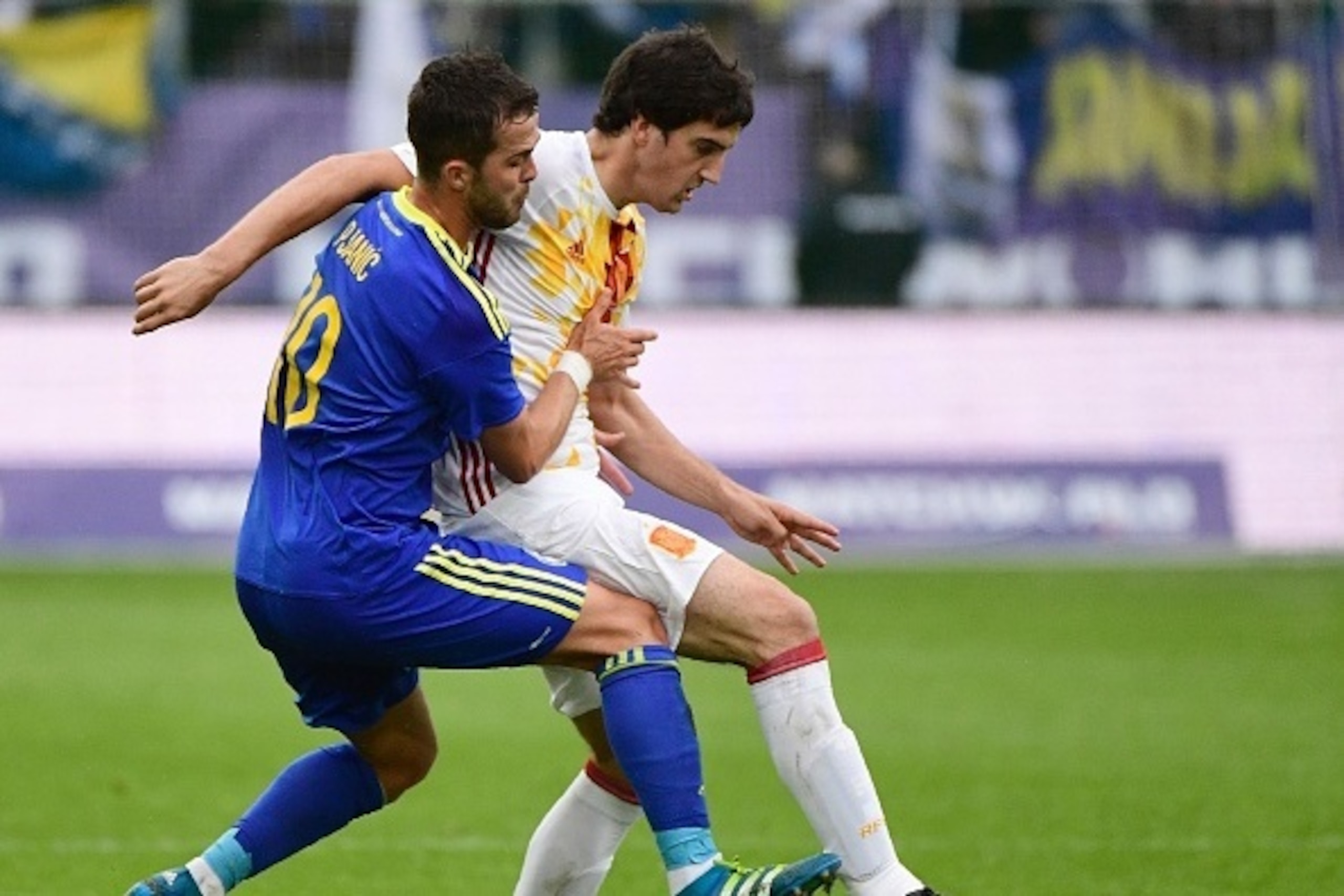 Spain's midfielder Mikel San Jose (R) vies with Bosnia's midfielder Miralem Pjanic during the friendly football match between Spain and Bosnia and Herzegovina at the AFG Arena in St Gallen, Switzerland, on May 29, 2016, in preparation for the upcoming Eur