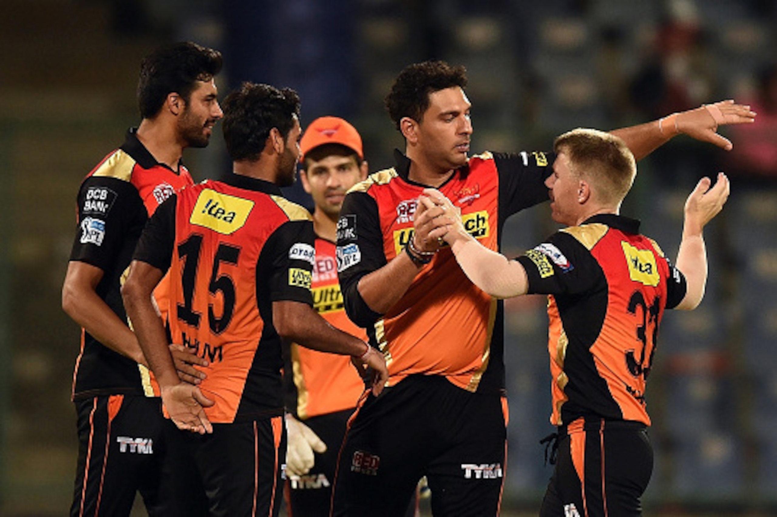Sunrisers Hyderabad captain David Warner (R) celebrates the victory over Kolkata Knight Riders with teammates  during the 2016 Indian Premier League (IPL) Twenty20 eliminator cricket match between Kolkata Knight Riders and Sunrisers Hyderabad at the Feroz