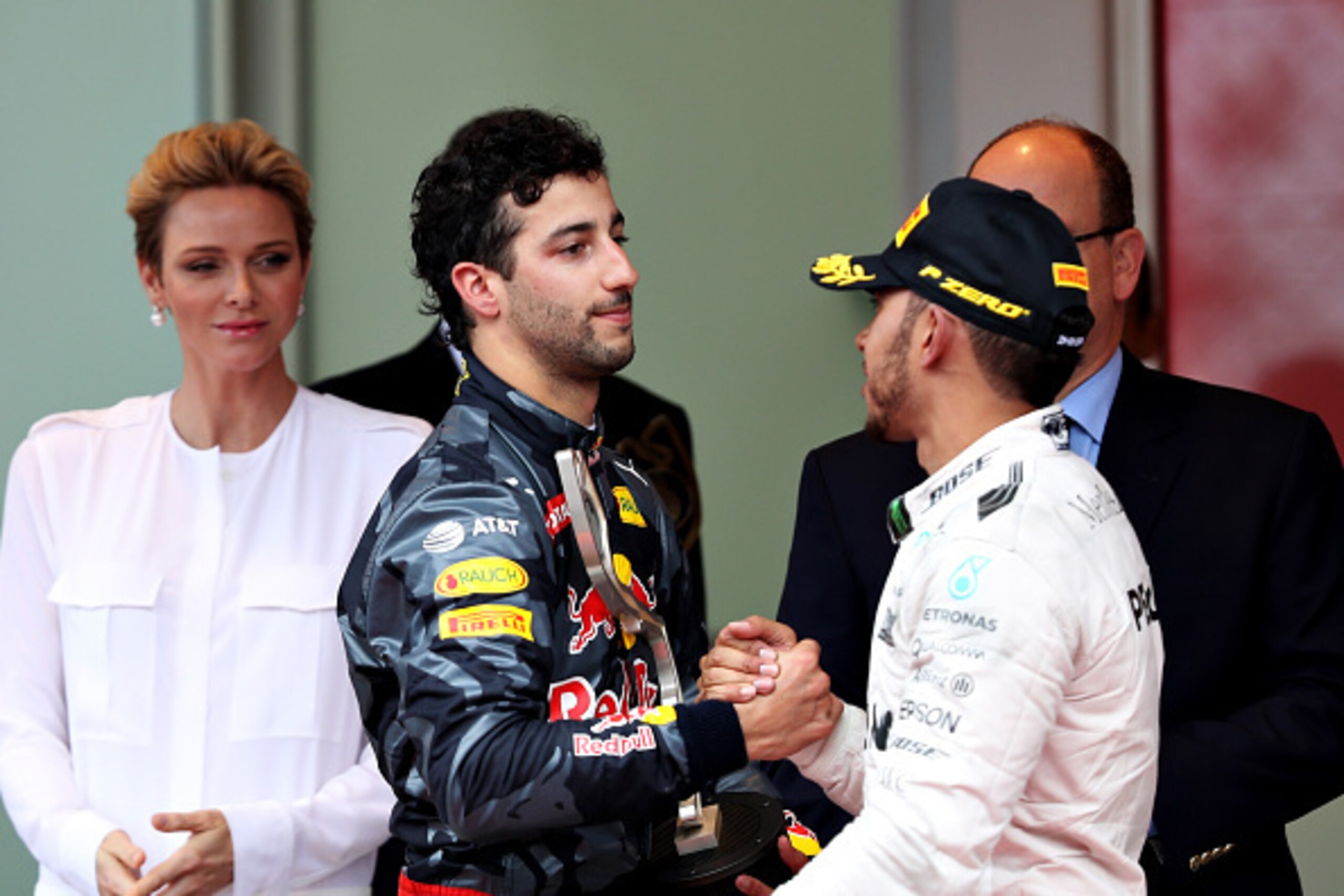 MONTE-CARLO, MONACO - MAY 29: Daniel Ricciardo of Australia and Red Bull Racing and Lewis Hamilton of Great Britain and Mercedes GP shake hands on the podium during the Monaco Formula One Grand Prix at Circuit de Monaco on May 29, 2016 in Monte-Carlo, Mon