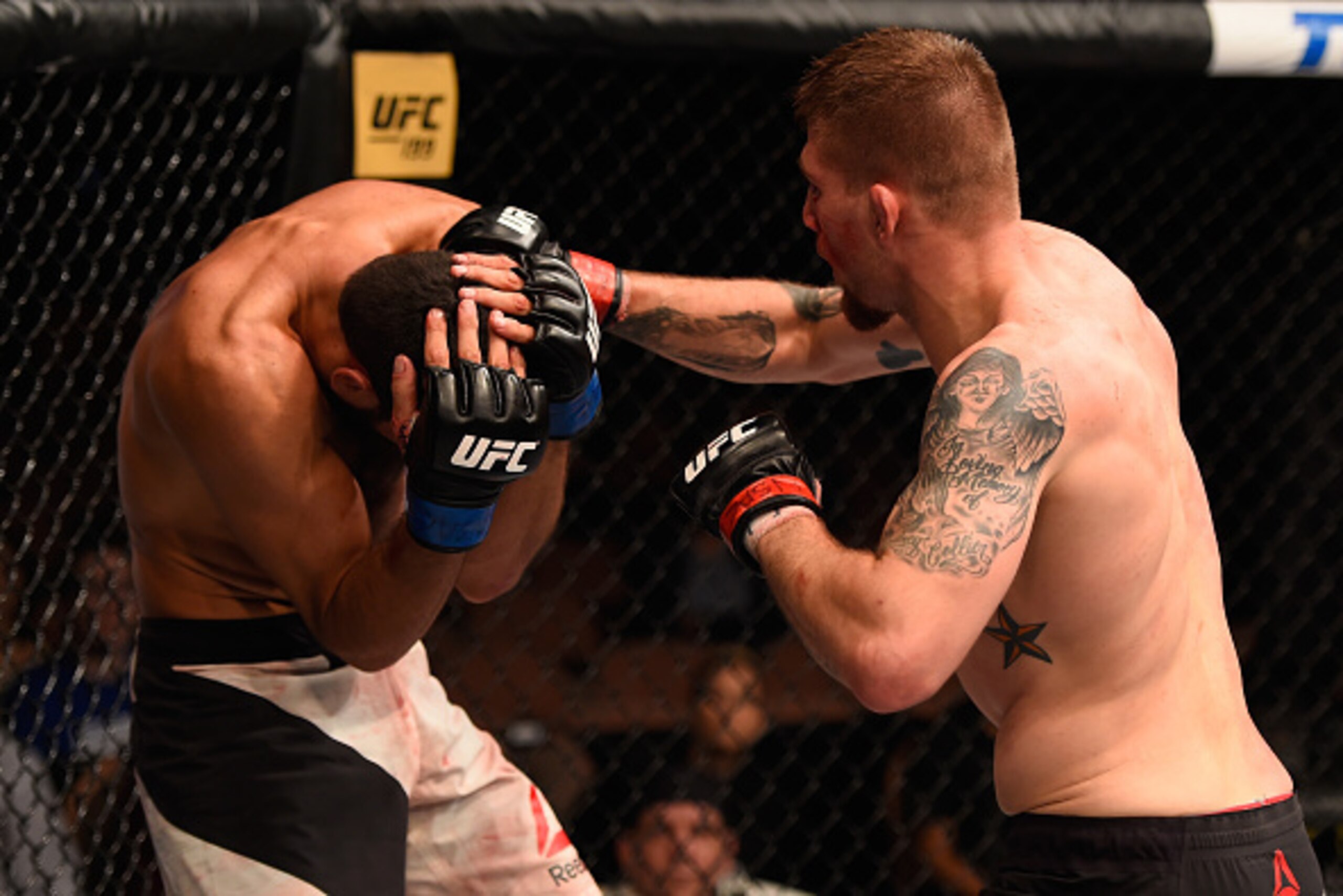 LAS VEGAS, NV - MAY 29: (R-L) Jake Collier punches Alberto Uda of Brazil in their middleweight bout during the UFC Fight Night event inside the Mandalay Bay Events Center on May 29, 2016 in Las Vegas, Nevada.  (Photo by Josh Hedges/Zuffa LLC/Zuffa LLC via