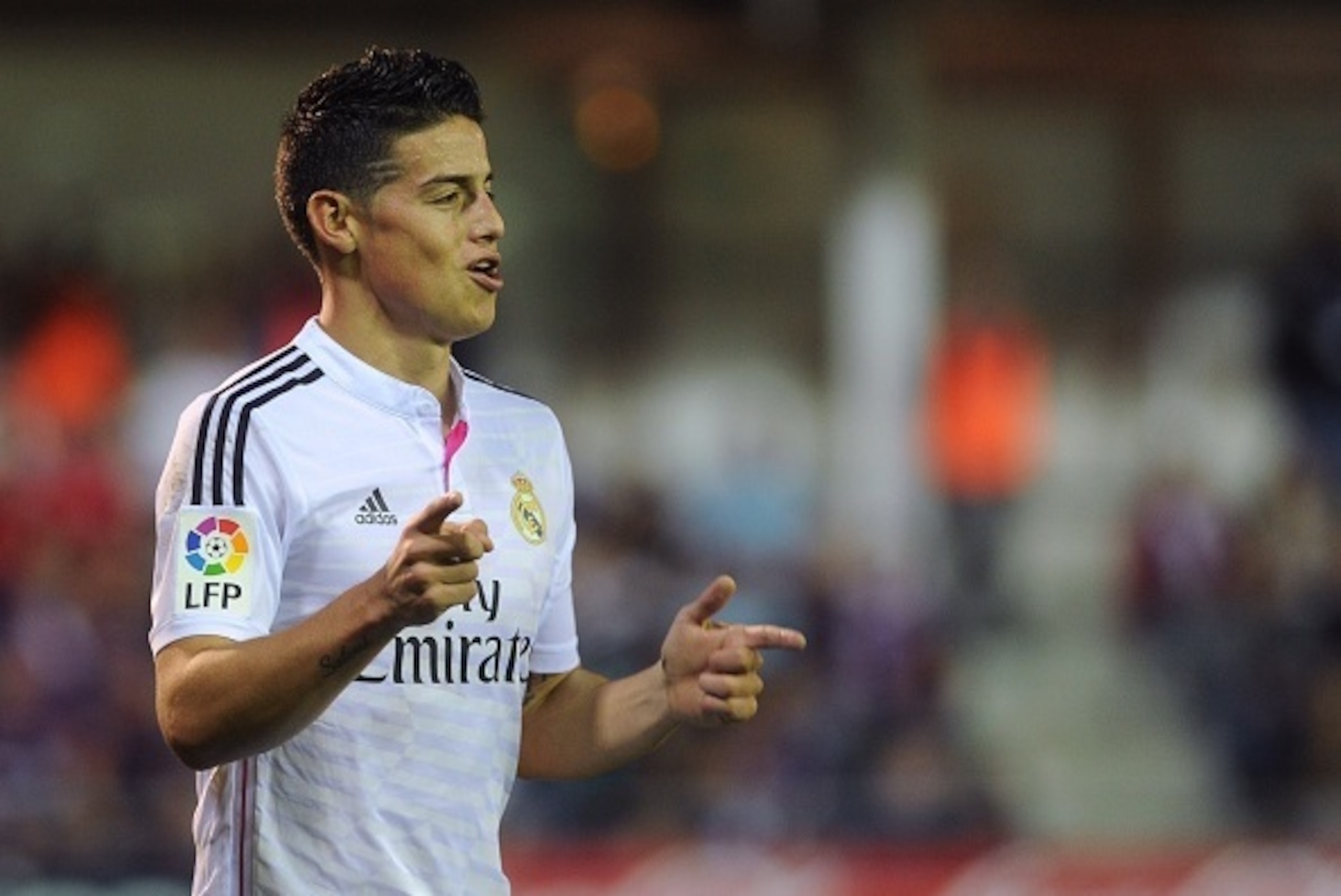 Real Madrid's Colombian forward James Rodriguez celebrates after scoring during the Spanish league football match SD Eibar vs Real Madrid CF at the Ipurua stadium in Eibar on November 22, 2014.   AFP PHOTO / RAFA RIVAS        (Photo credit should read RAF