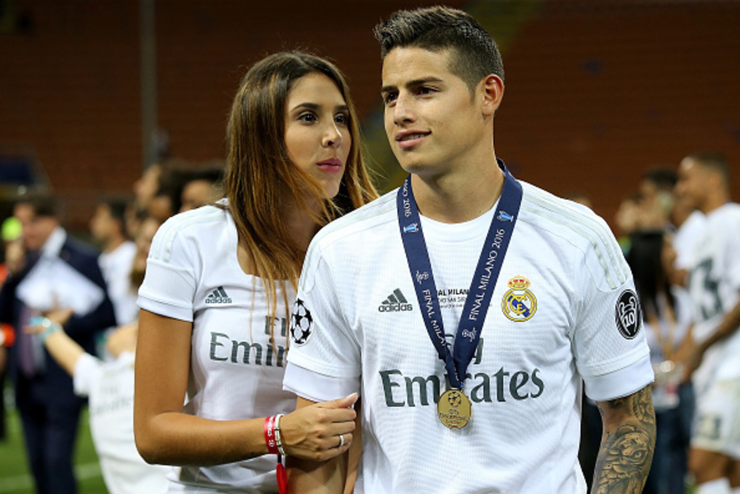 MILAN, ITALY - MAY 28:  James Rodriguez of Real Madrid poses with his winners medal and wife Daniela Ospina following his team's victory in a penalty shootout during the UEFA Champions League final match between Real Madrid and Club Atletico de Madrid at 