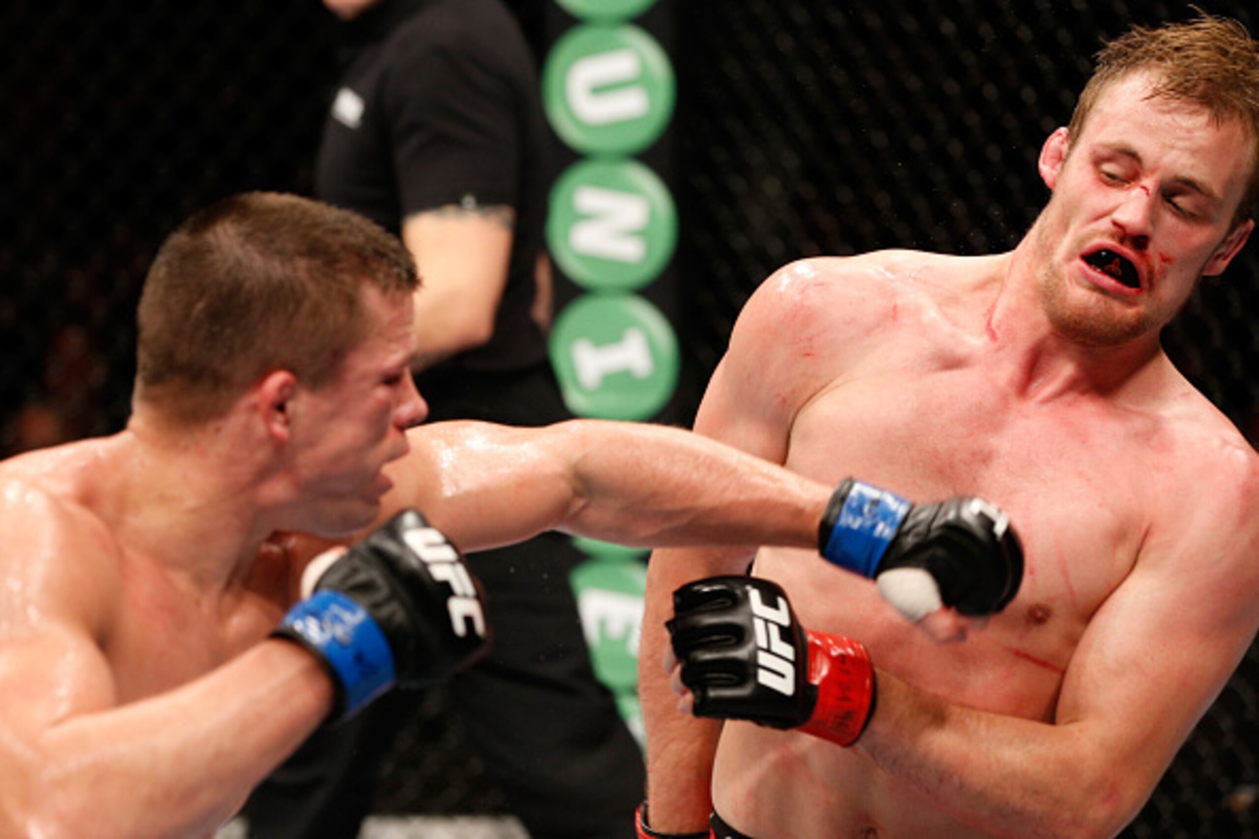 STOCKHOLM, SWEDEN - OCTOBER 04:  (l-R) Rick Story punches Gunnar Nelson of Iceland in their welterweight bout at the Ericsson Globe Arena on October 4, 2014 in Stockholm, Sweden.  (Photo by Josh Hedges/Zuffa LLC/Zuffa LLC)