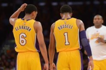 Mar 8, 2016; Los Angeles, CA, USA; Los Angeles Lakers guard Jordan Clarkson (6) and Lakers guard D'Angelo Russell (1) speak in the second half of the game against the Orlando Magic at Staples Center. The Lakers won 107-98. Mandatory Credit: Jayne Kamin-On
