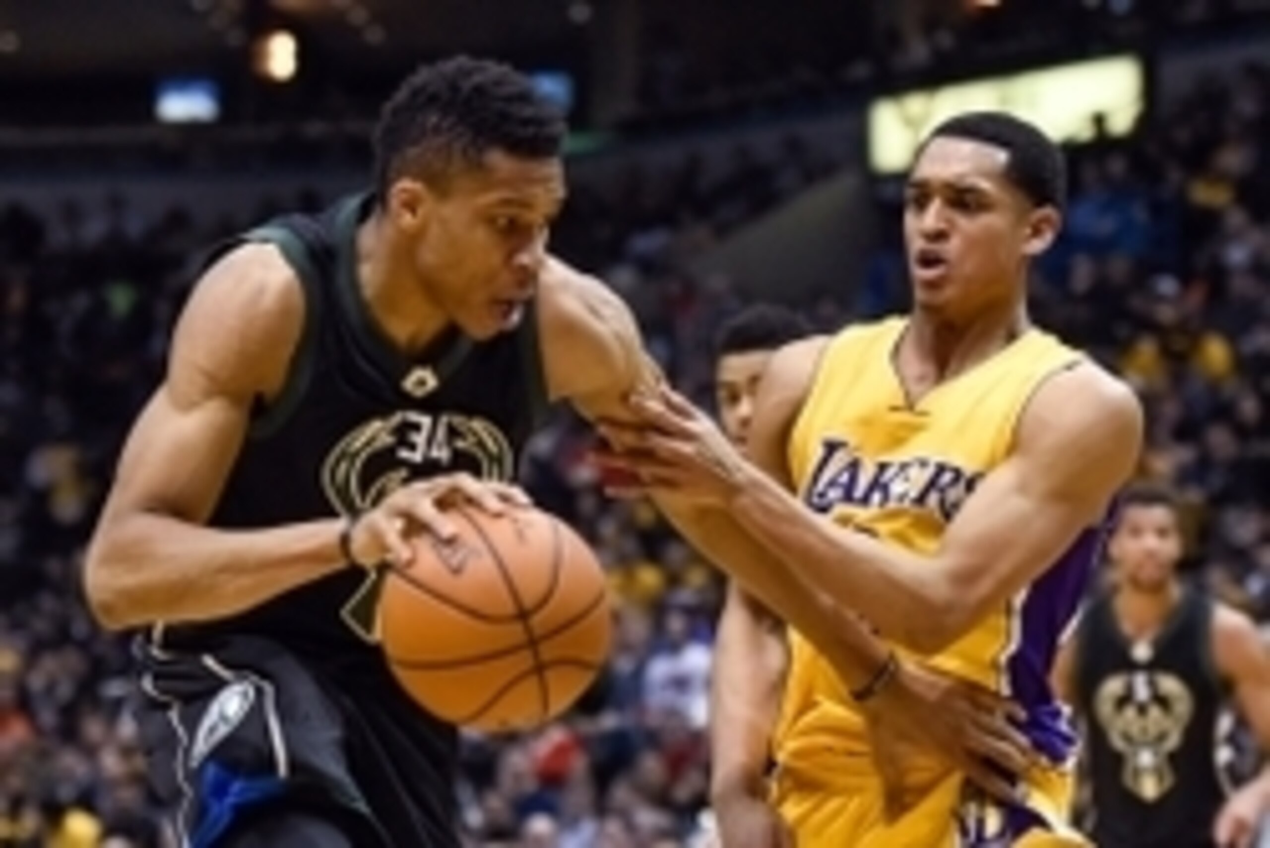 Feb 22, 2016; Milwaukee, WI, USA;  Milwaukee Bucks forward Giannis Antetokounmpo (34) drives for the basket against Los Angeles Lakers guard Jordan Clarkson (6) in the second quarter at BMO Harris Bradley Center. Mandatory Credit: Benny Sieu-USA TODAY Spo