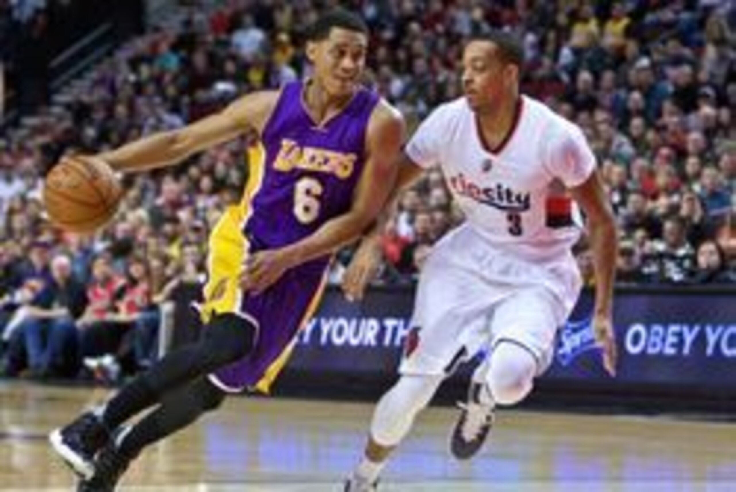 Jan 23, 2016; Portland, OR, USA; Los Angeles Lakers guard Jordan Clarkson (6) drives past Portland Trail Blazers guard C.J. McCollum (3) during the first quarter at the Moda Center. Mandatory Credit: Craig Mitchelldyer-USA TODAY Sports