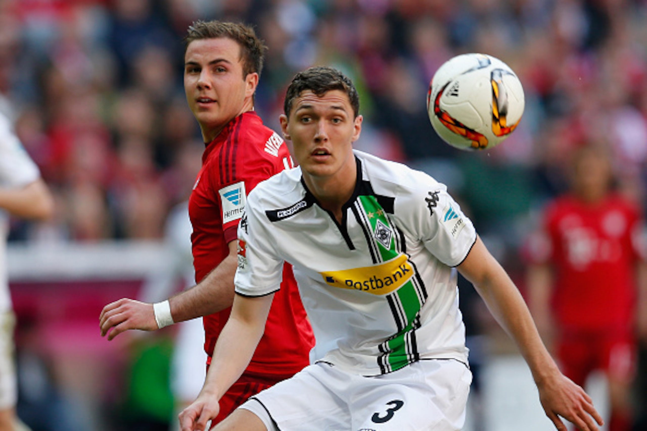 MUNICH, GERMANY - APRIL 30: Andreas Christensen (R) of Borussia Moenchengladbach and Mario Goetze of Bayern Muenchen compete for the ball during the Bundesliga match between Bayern Muenchen and Borussia Moenchengladbach at Allianz Arena on April 30, 2016 MUNICH, GERMANY - APRIL 30: Andreas Christensen (R) of Borussia Moenchengladbach and Mario Goetze of Bayern Muenchen compete for the ball during the Bundesliga match between Bayern Muenchen and Borussia Moenchengladbach at Allianz Arena on April 30, 2016