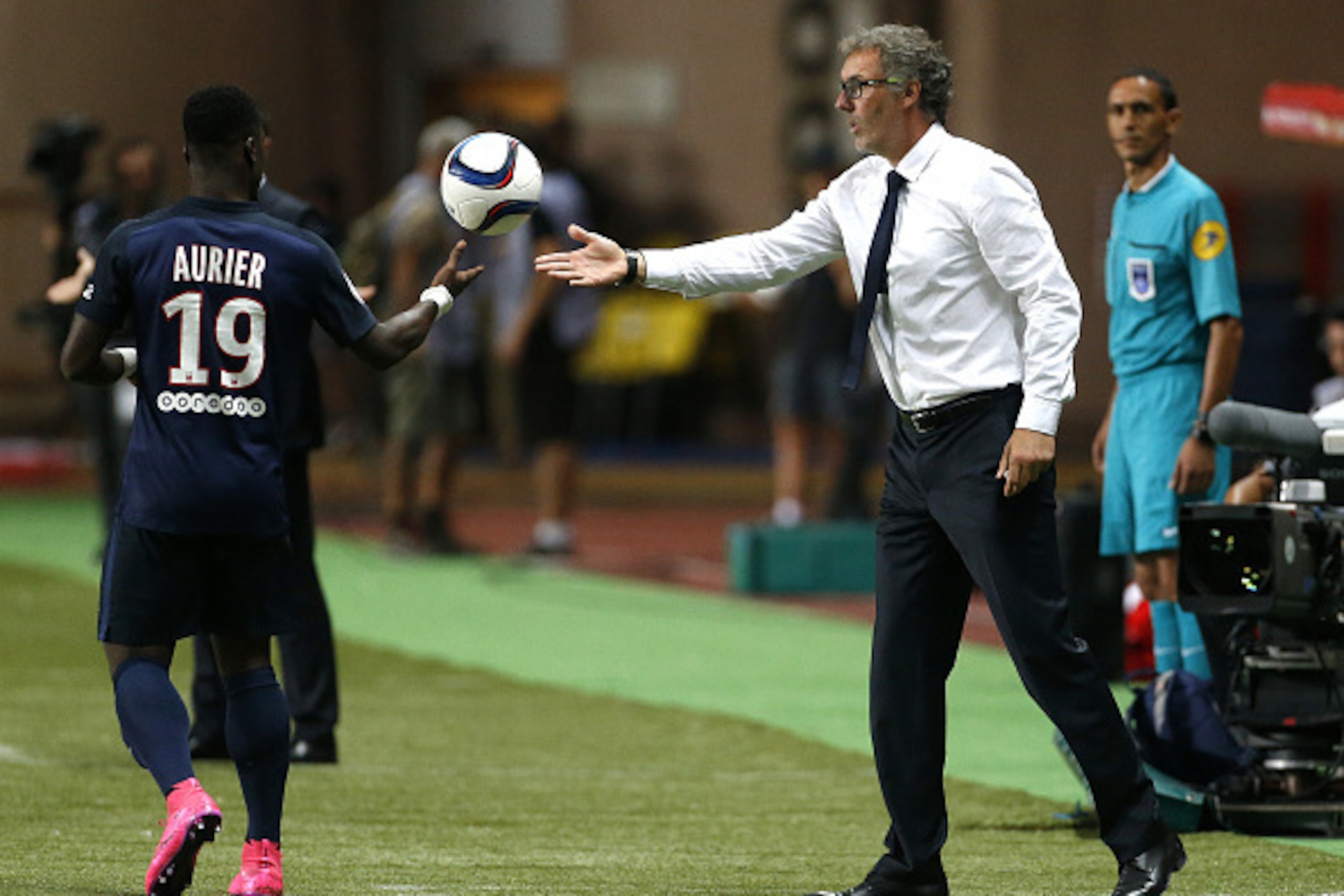 MONACO - AUGUST 30: Coach of PSG Laurent Blanc gives the ball to Serge Aurier of PSG during the French Ligue 1 match between AS Monaco and Paris Saint-Germain at Stade Louis II on August 30, 2015 in Monaco. (Photo by Jean Catuffe/Getty Images)