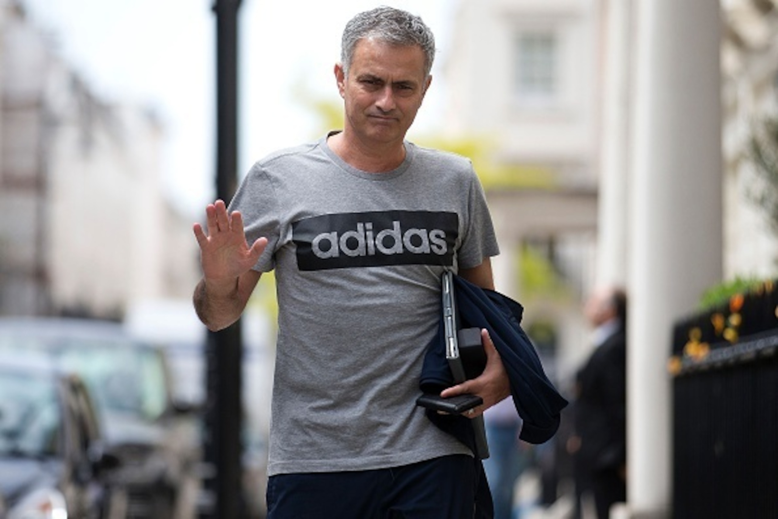 Manchester United's new Portuguese manager Jose Mourinho waves as he returns to his home in central London on May 27, 2016.
Manchester United on Friday anointed Jose Mourinho as their new manager to launch a third bid in less than three years to transform