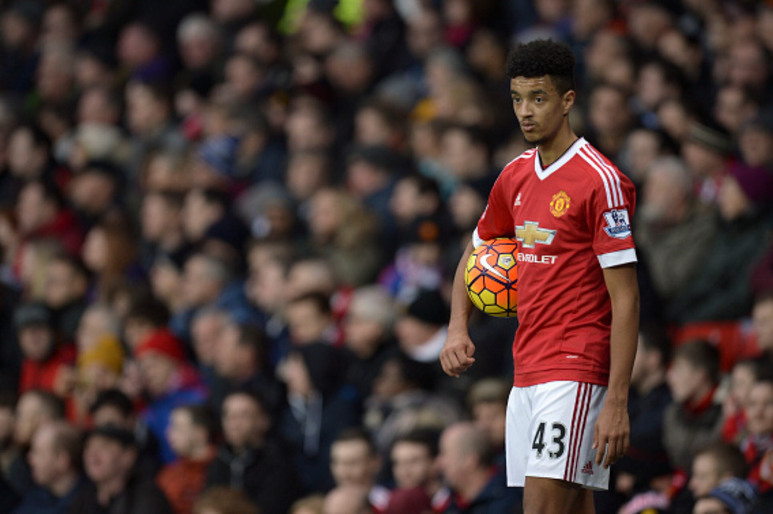 Manchester United's English defender Cameron Borthwick-Jackson prepares to take a throw in during the English Premier League football match between Manchester United and Southampton at Old Trafford in Manchester, north west England, on January 23, 2016. A