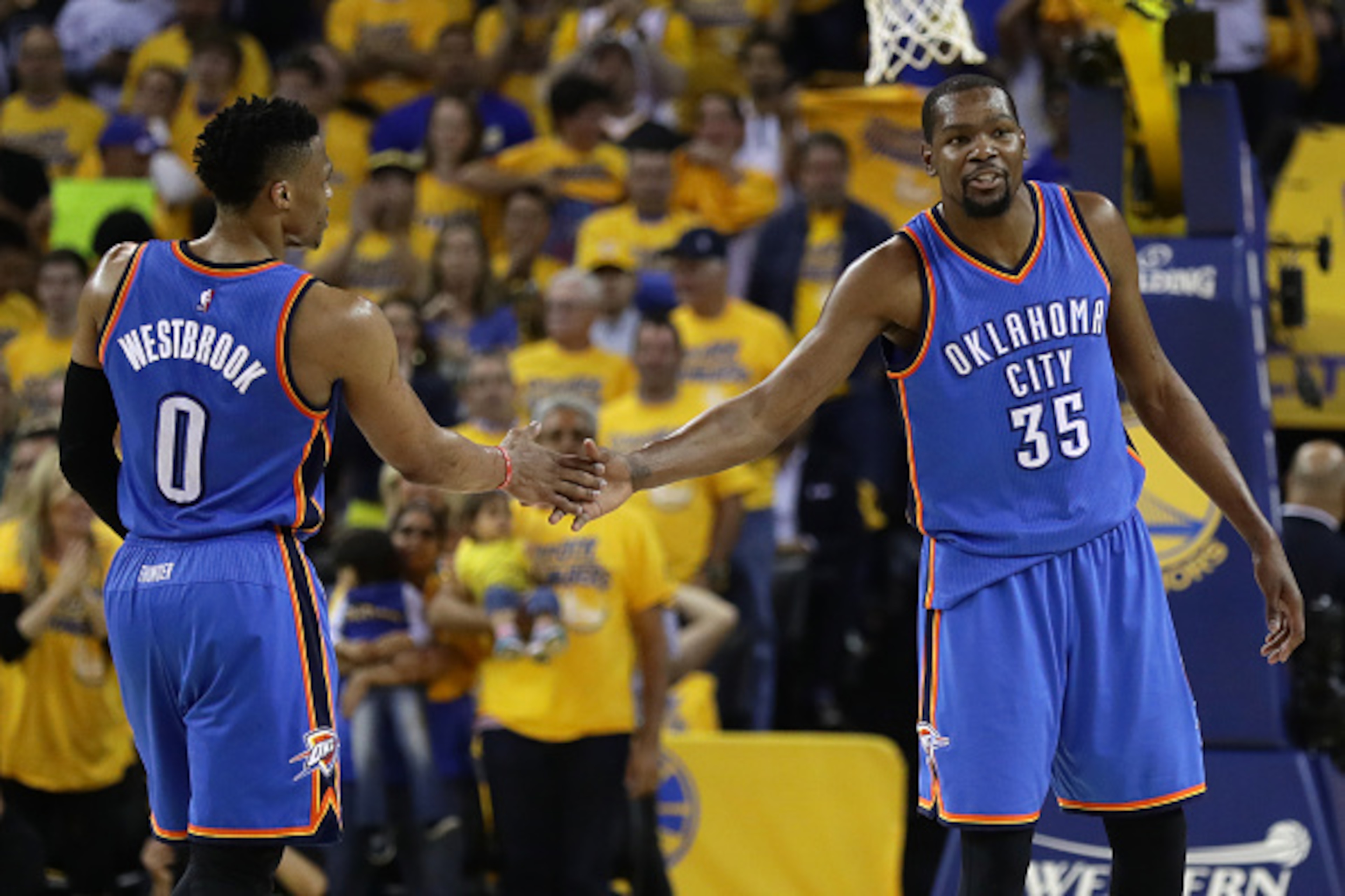 OAKLAND, CA - MAY 26: Russell Westbrook #0 and Kevin Durant #35 of the Oklahoma City Thunder celebrate after a play against the Golden State Warriors during Game Five of the Western Conference Finals during the 2016 NBA Playoffs at ORACLE Arena on May 26 OAKLAND, CA - MAY 26: Russell Westbrook #0 and Kevin Durant #35 of the Oklahoma City Thunder celebrate after a play against the Golden State Warriors during Game Five of the Western Conference Finals during the 2016 NBA Playoffs at ORACLE Arena on May 26