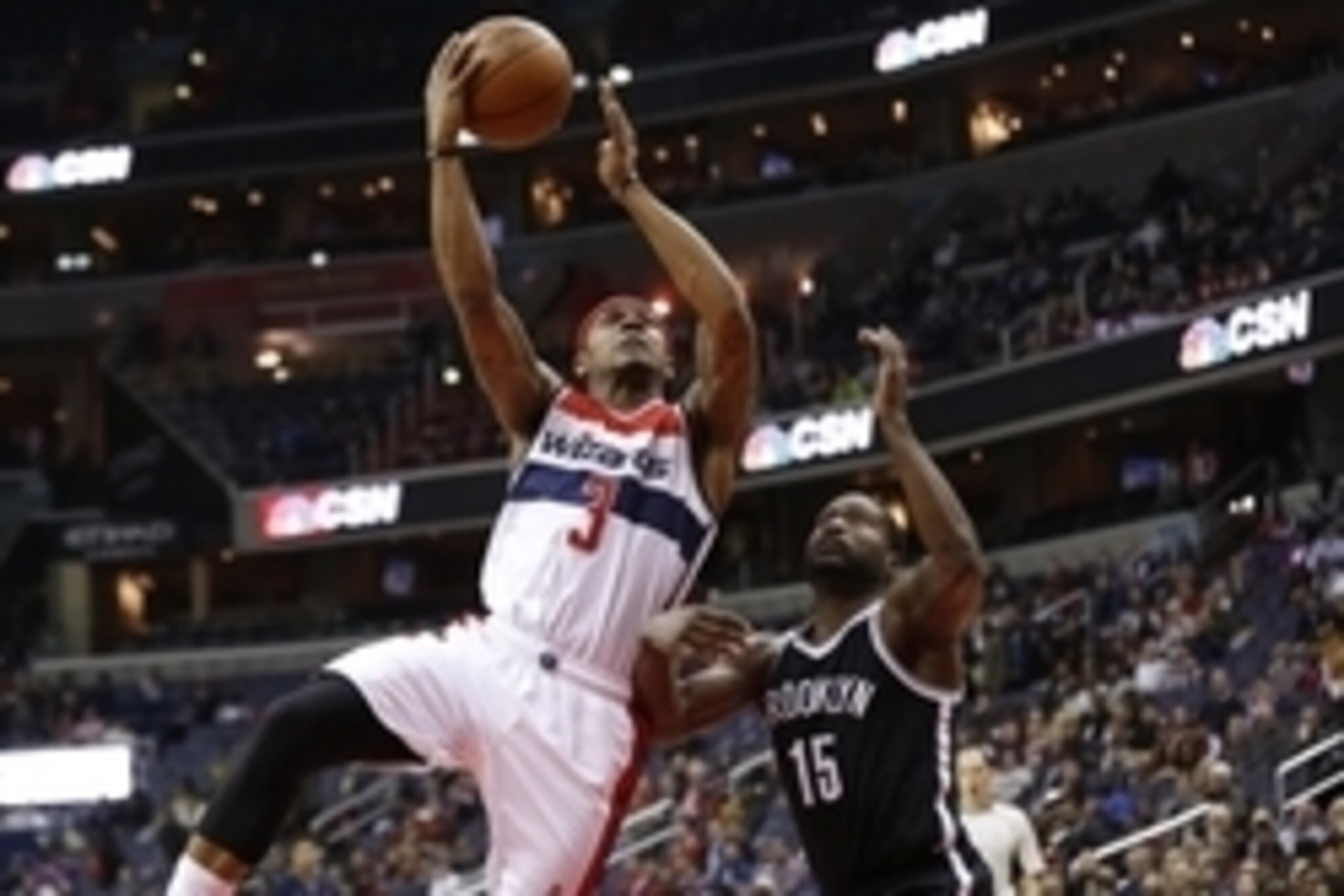 Apr 6, 2016; Washington, DC, USA; Washington Wizards guard Bradley Beal (3) shoots the ball as Brooklyn Nets guard Donald Sloan (15) defends in the first quarter at Verizon Center. Mandatory Credit: Geoff Burke-USA TODAY Sports