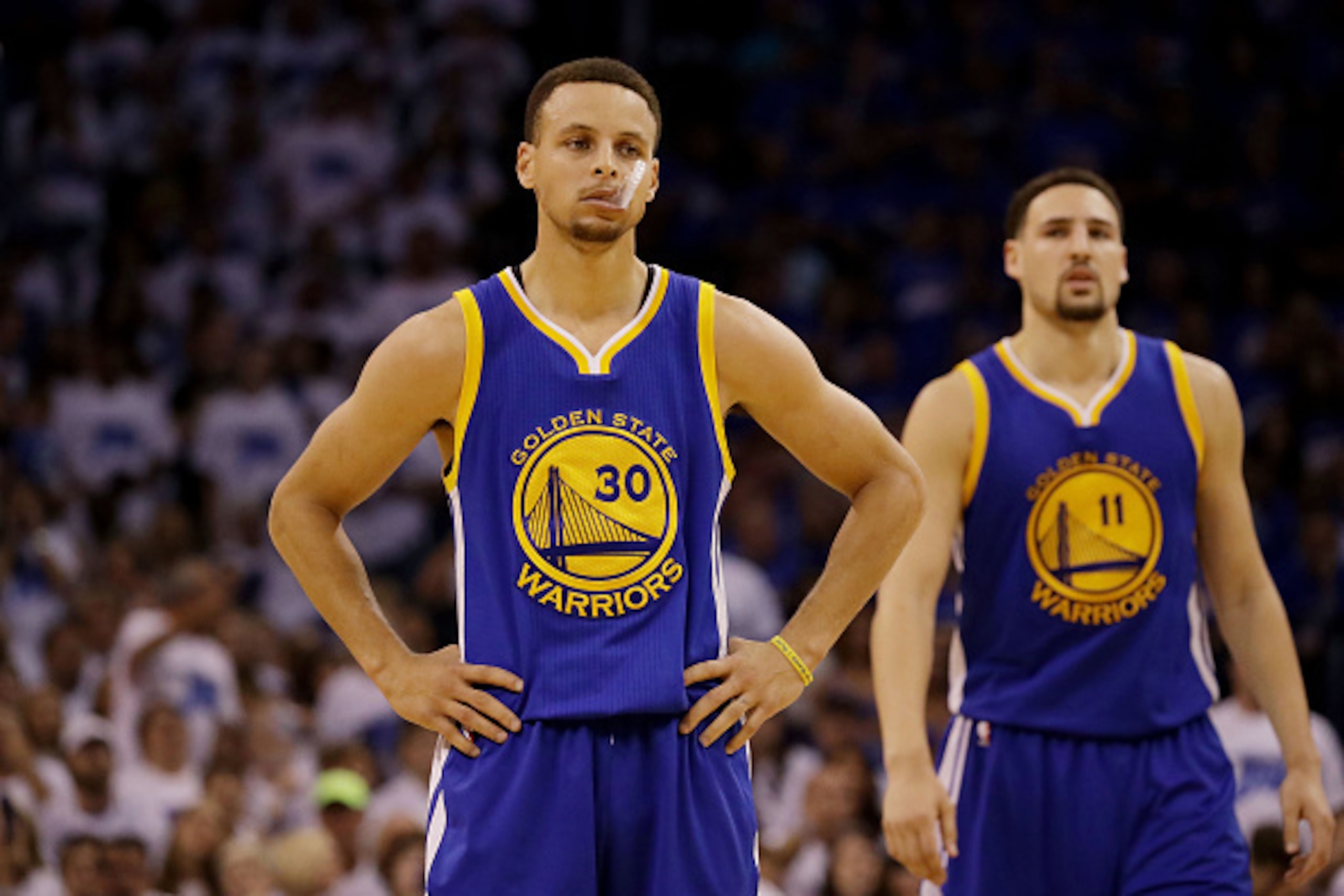 OKLAHOMA CITY, OK - MAY 22:  Stephen Curry #30 and Klay Thompson #11 of the Golden State Warriors react in the second quarter against the Oklahoma City Thunder in game three of the Western Conference Finals during the 2016 NBA Playoffs at Chesapeake Energ