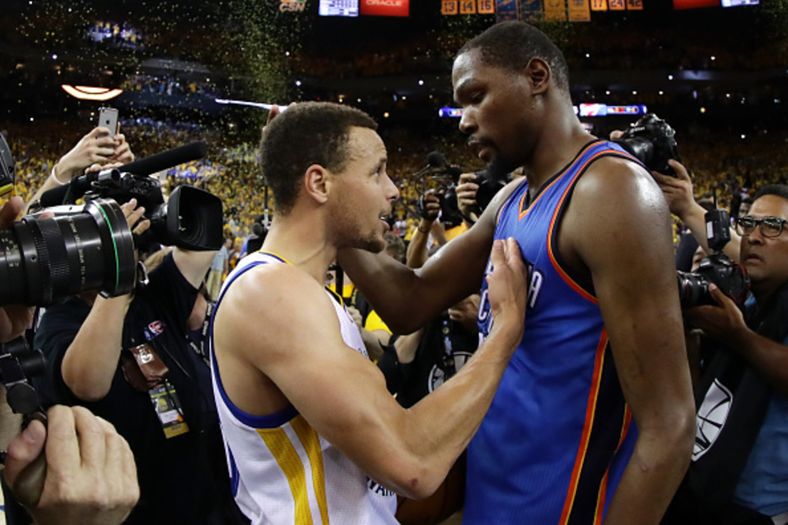 OAKLAND, CA - MAY 30:  Stephen Curry #30 of the Golden State Warriors speaks with Kevin Durant #35 of the Oklahoma City Thunder after their 96-88 win in Game Seven of the Western Conference Finals during the 2016 NBA Playoffs at ORACLE Arena on May 30, 20